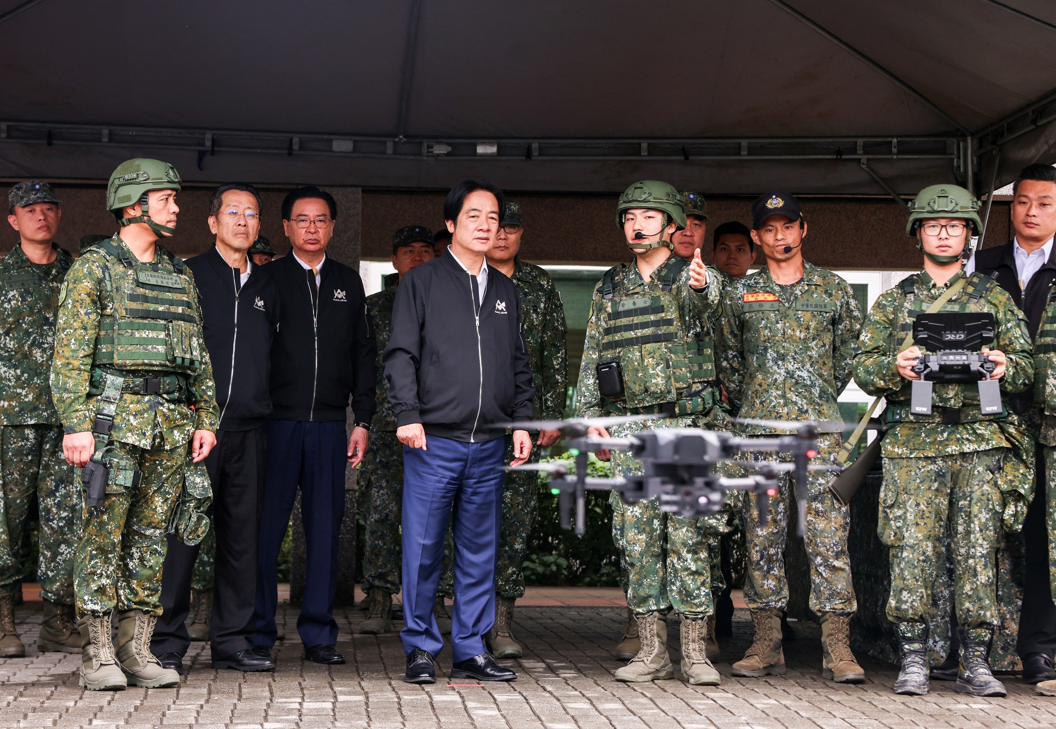 Taiwan president Lai Ching-te inspects reservists operating a Hummer 2 Drone during a training session in Yilan County