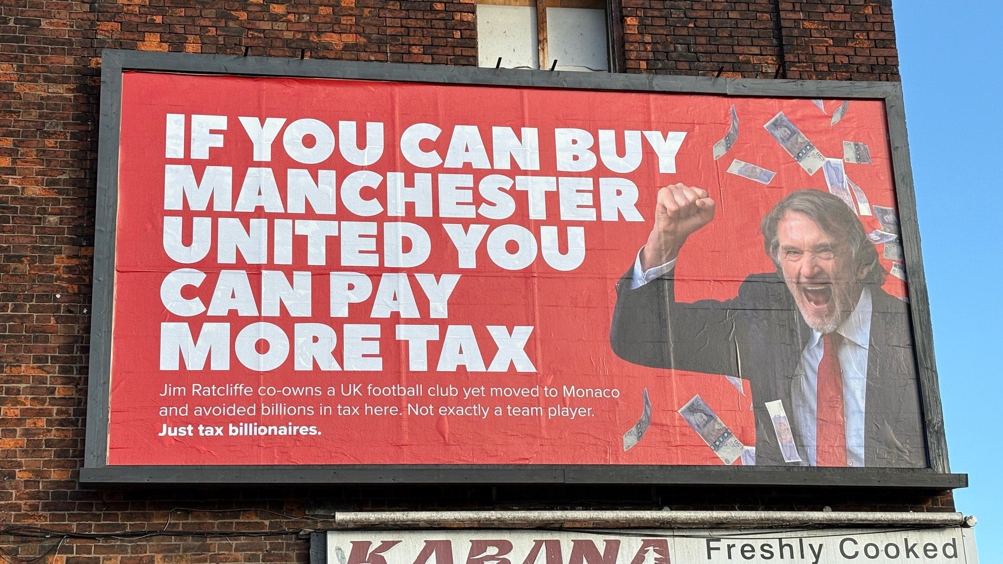 A billboard in Manchester takes aim at Ratcliffe’s tax arrangements