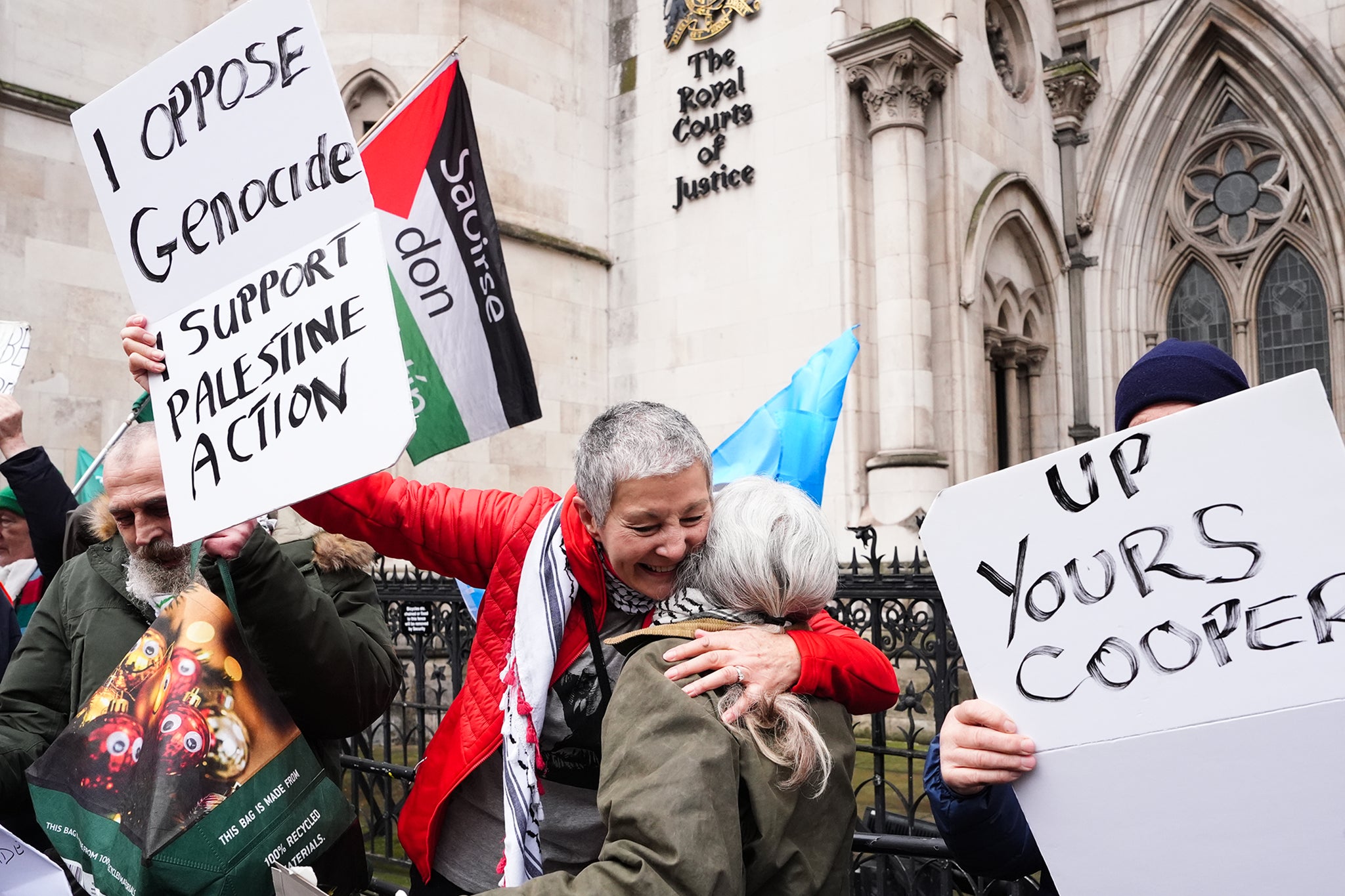 Protesters celebrate outside the High Court in London on Friday