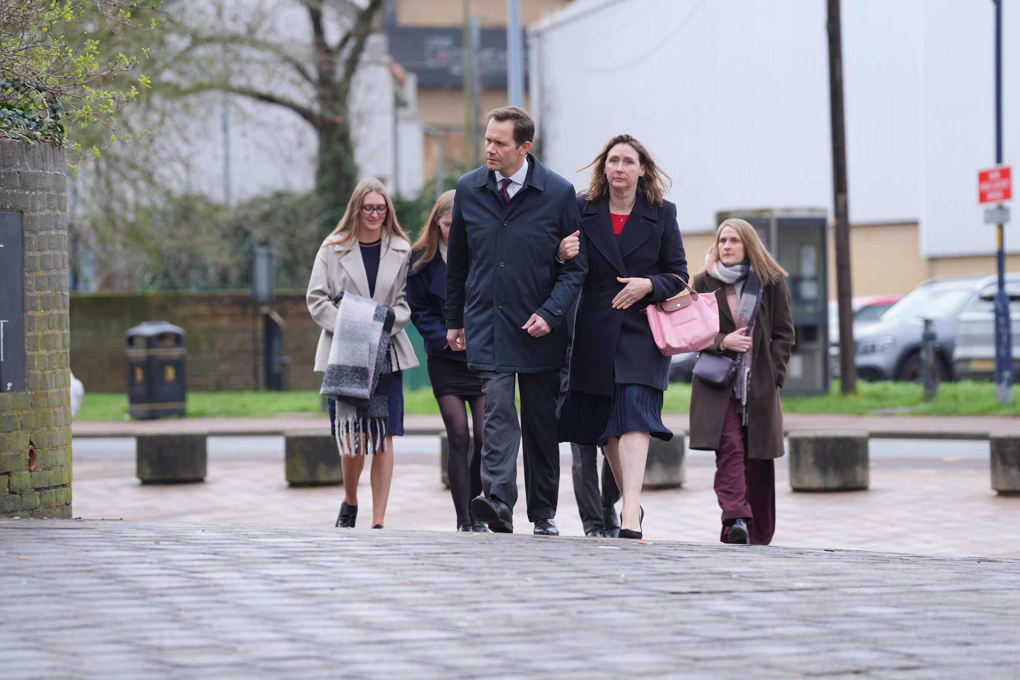 Mark Teeton arrives at court with his family