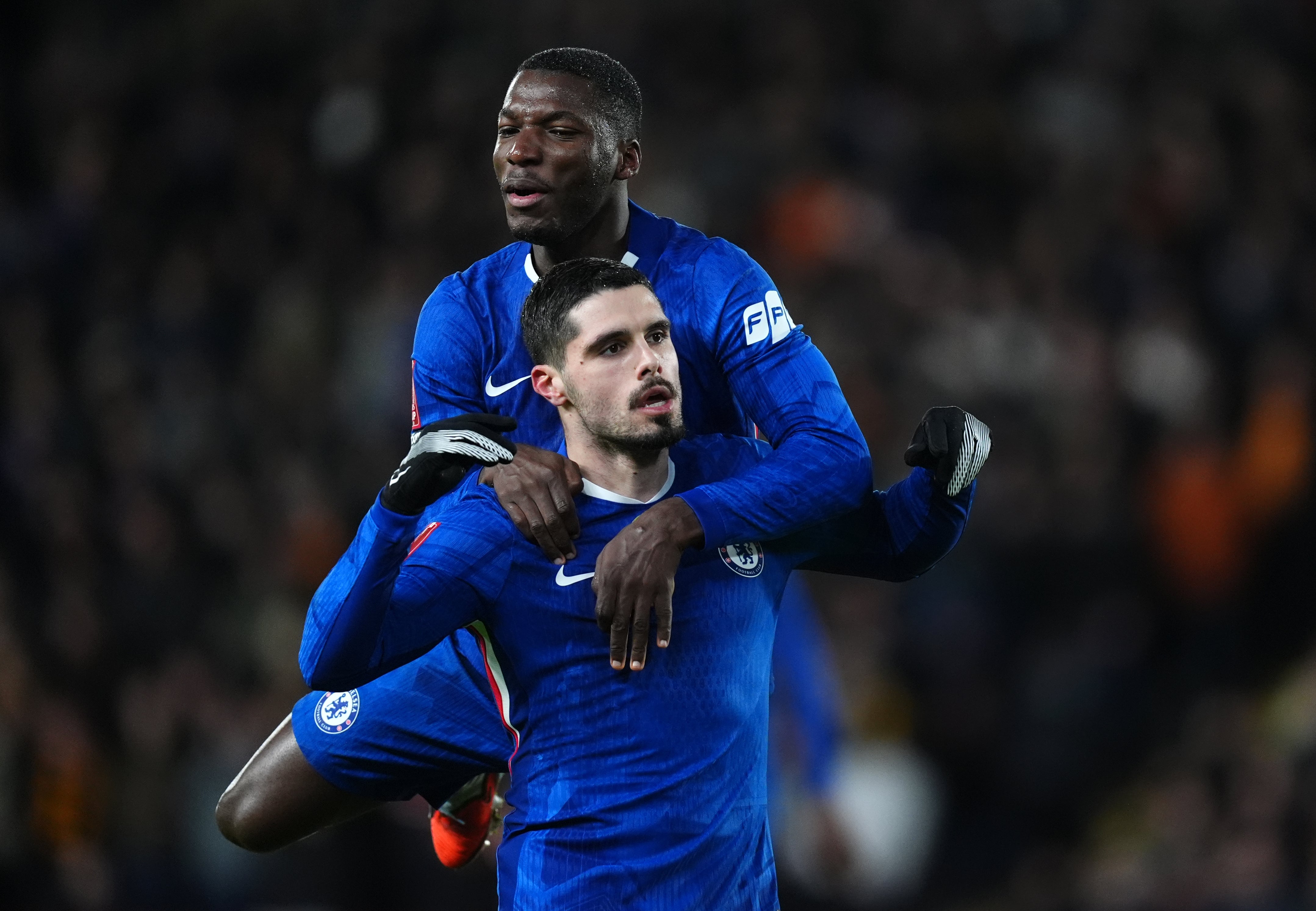 Chelsea's Pedro Neto (right) celebrates with team-mate Moises Caicedo
