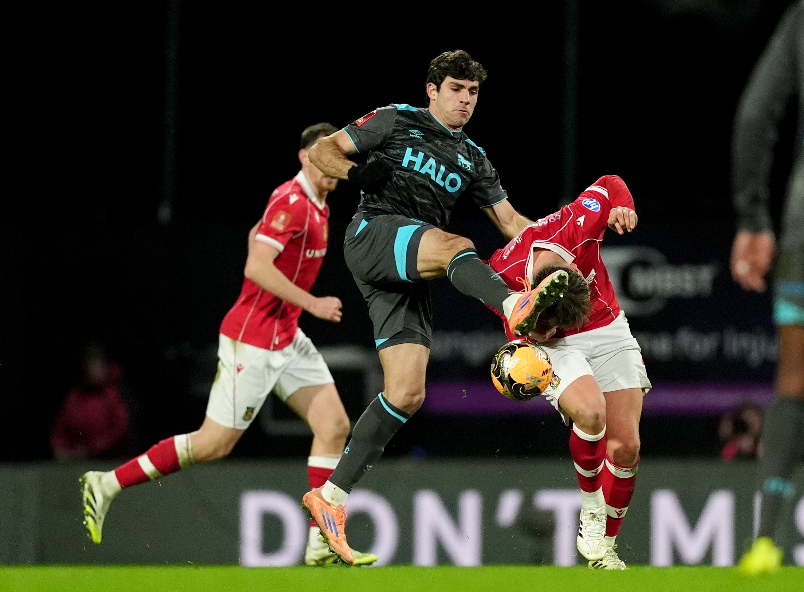 Ipswich Town's Ivan Azon (left) and Wrexham's Callum Doyle battle for the ball