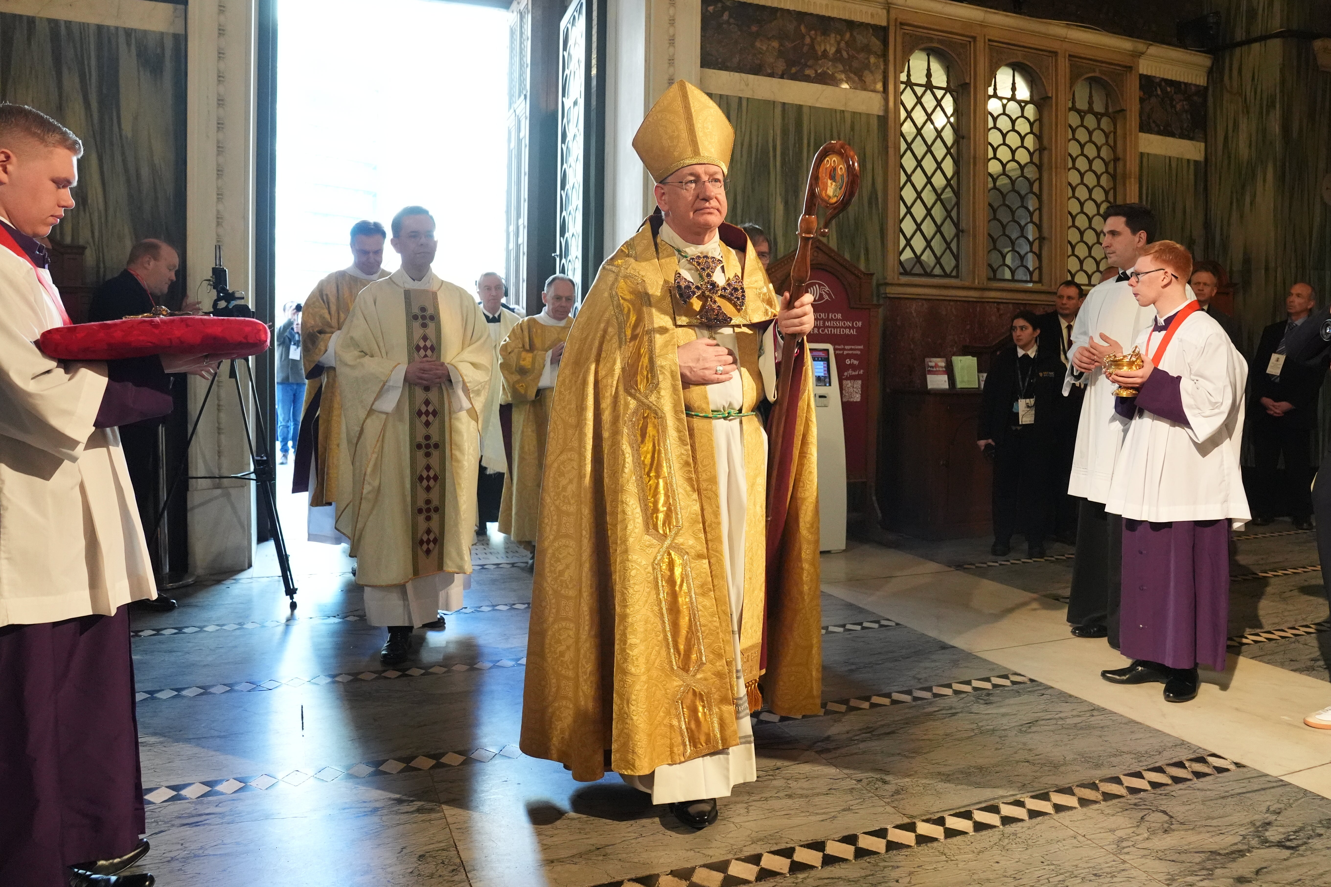 Bishop Richard Moth (centre) arriving for his installation