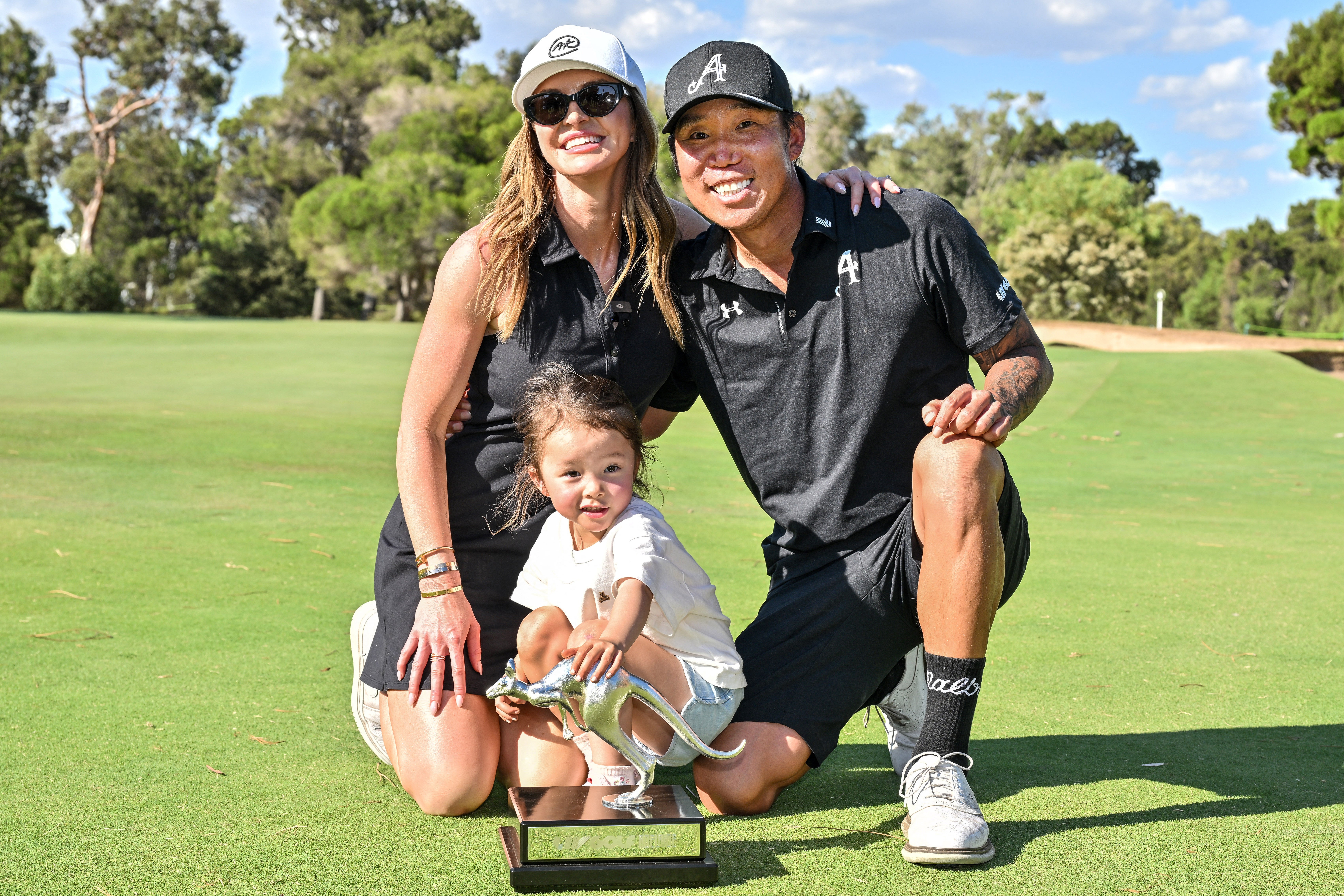 Anthony Kim celebrated with his family after an emotional win