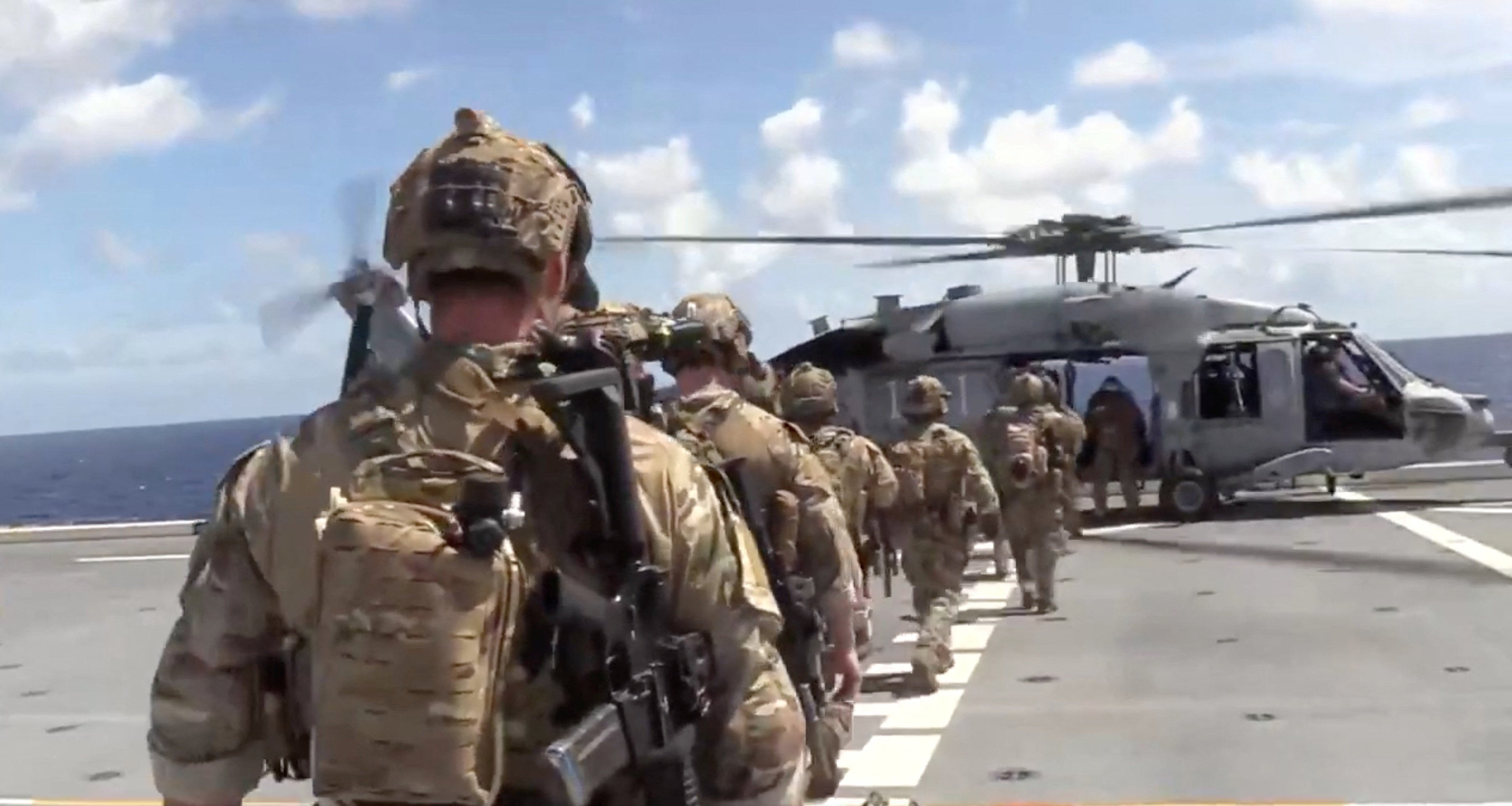U.S. forces prepare to board the vessel Veronica III