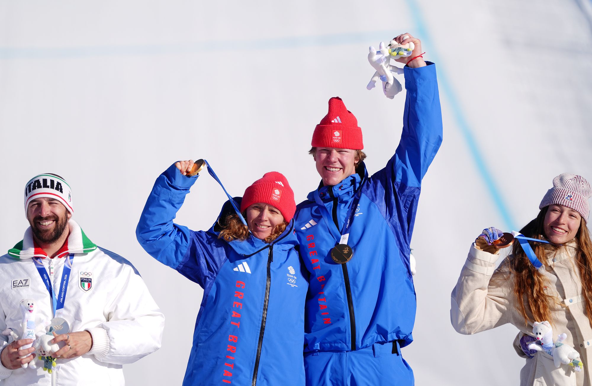 GB’s Charlotte Bankes and Huw Nightingale make history with stunning Olympic gold in mixed snowboard cross
