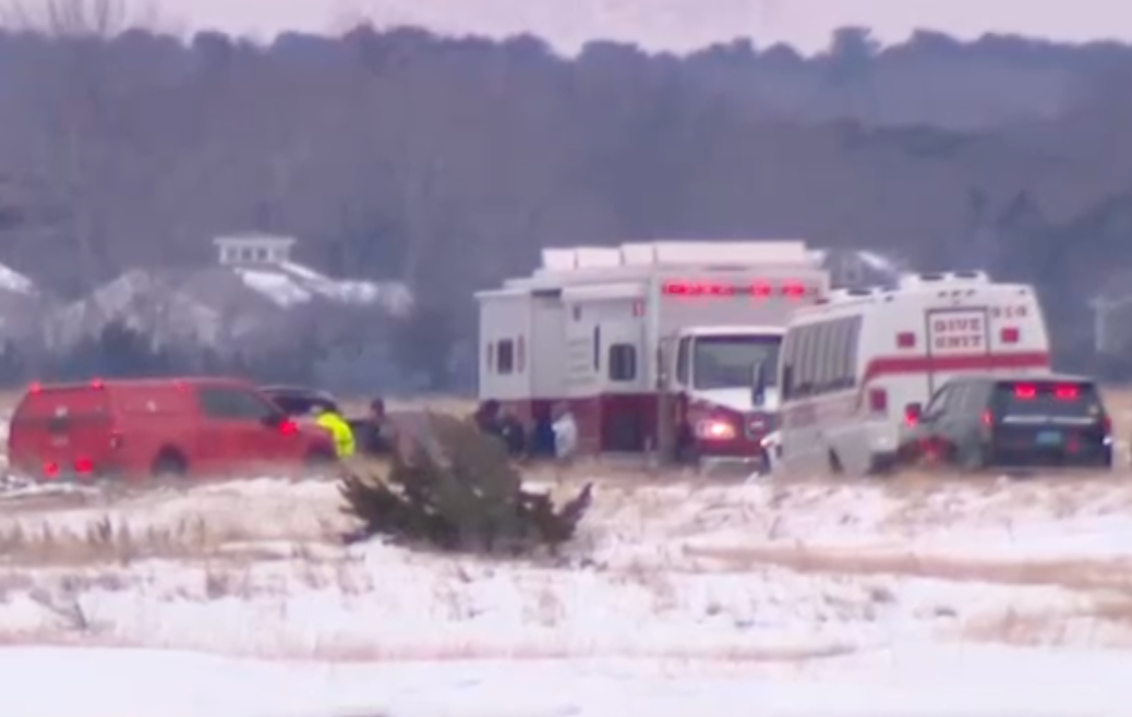 Emergency vehicles near Bee's River in Eastham, Massachusetts. A couple is believed to have fallen through the ice on Bee's River while walking their dog