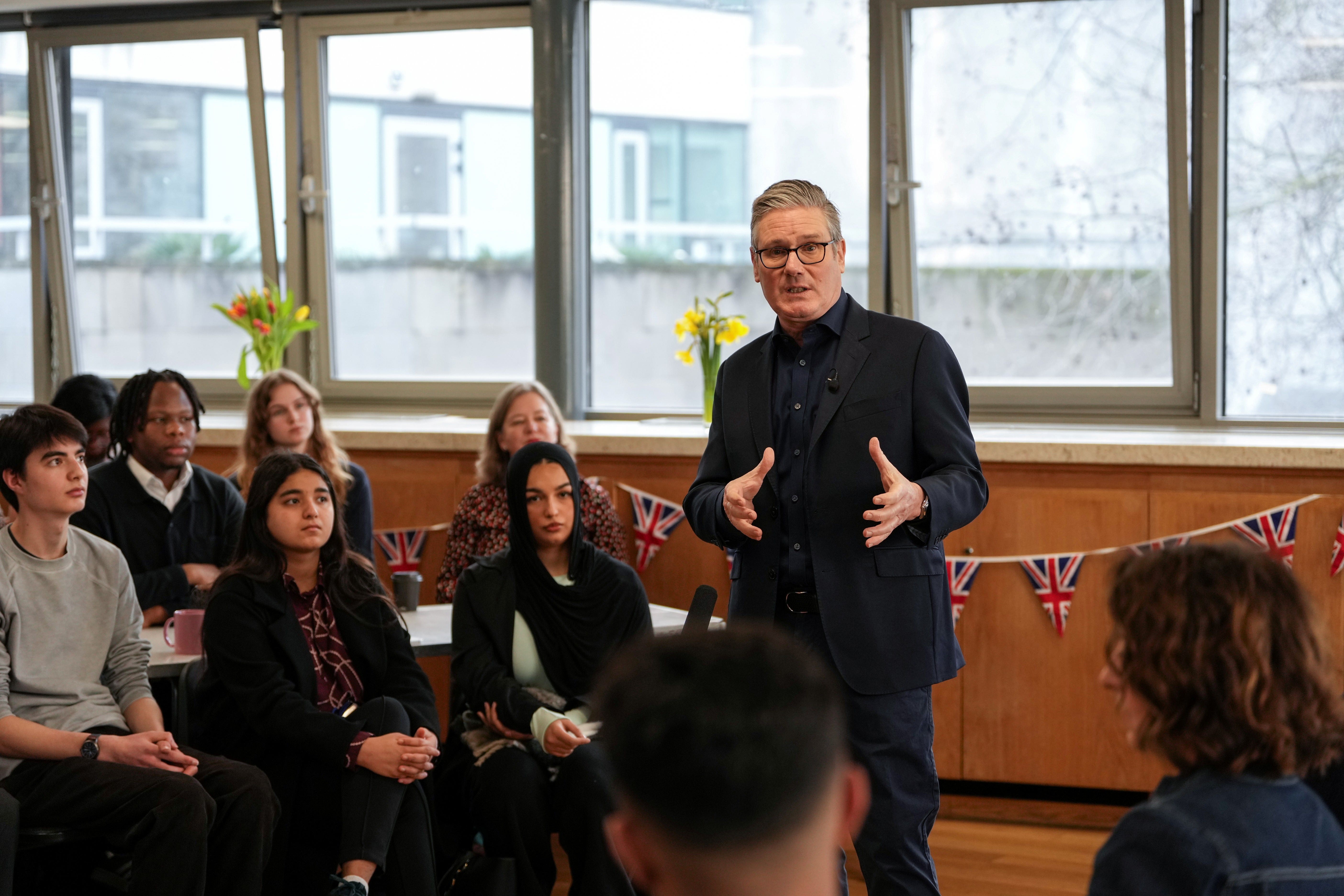 Prime Minister Sir Keir Starmer speaks to local residents during a visit to a community hub at St Mary’s Church in Putney, south-west London (Carlos Jasso/PA)
