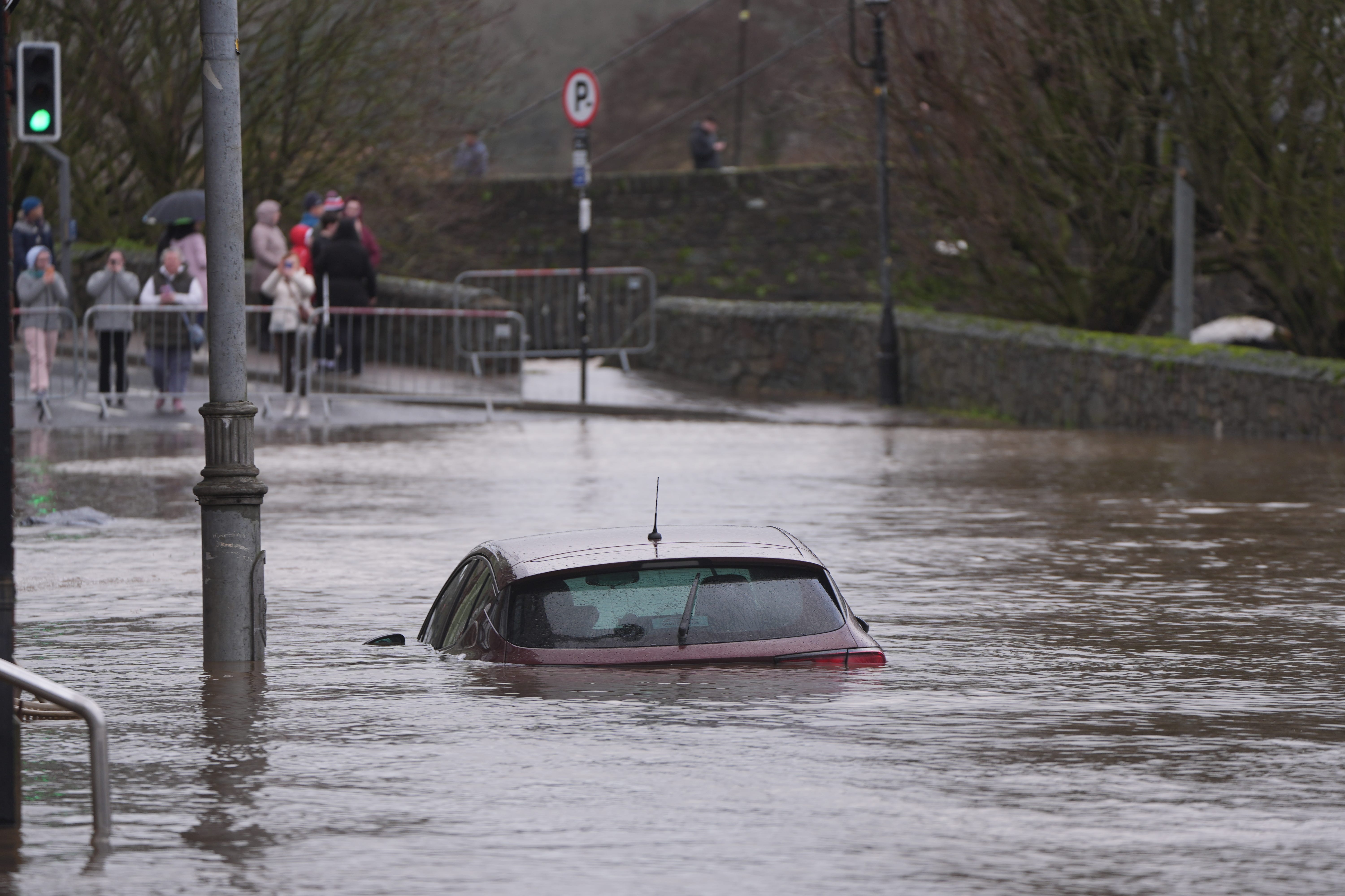 A car engulfed in floodwater in Enniscorthy, Co Wexford (Niall Carson/PA)