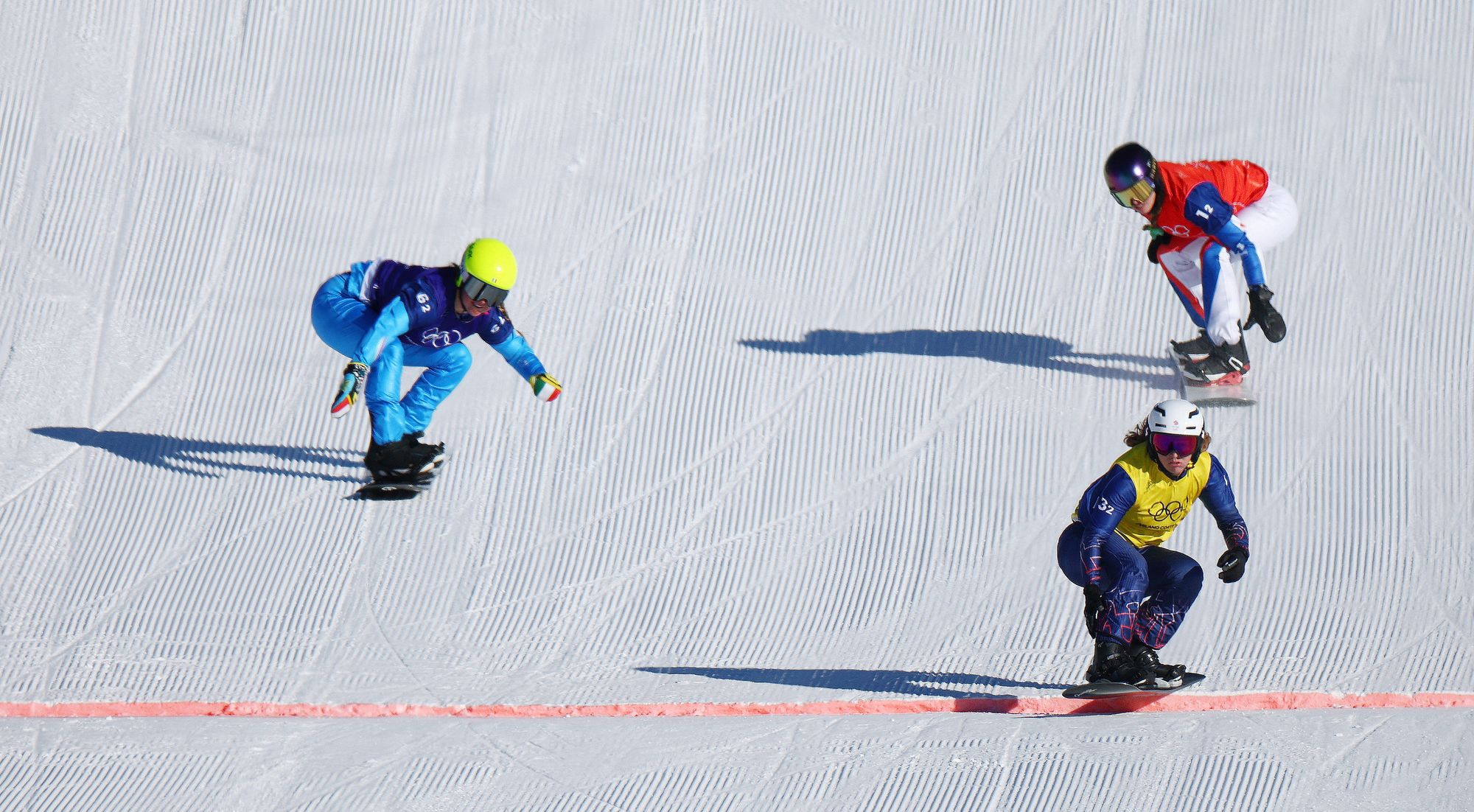 Charlotte Bankes crosses the line to win Team GB's first ever gold medal on snow