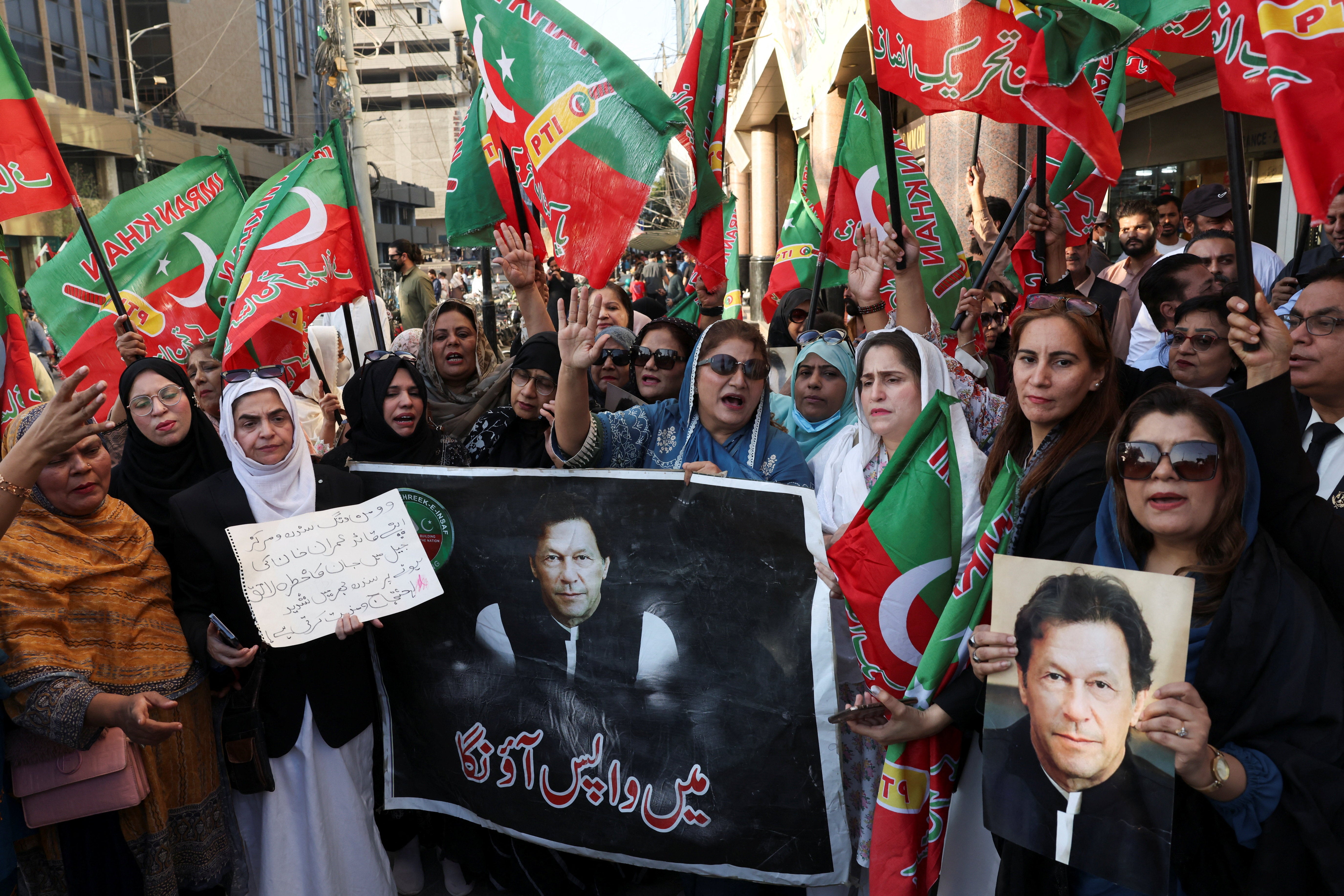 Supporters of jailed former Prime Minister Imran Khan's Pakistan Tehreek-e-Insaf (PTI) party chant slogans during a protest over concerns about their leader's health in Karachi, Pakistan