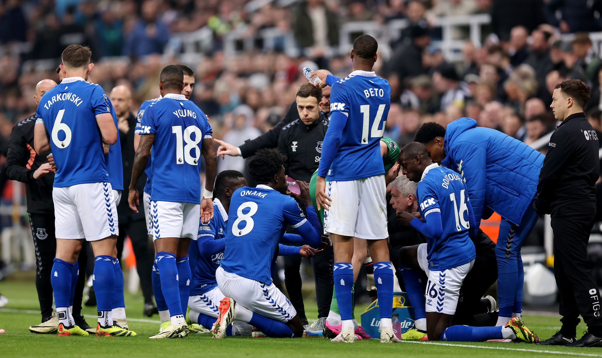 Players break their fast during a game between Everton and Newcastle in April 2024