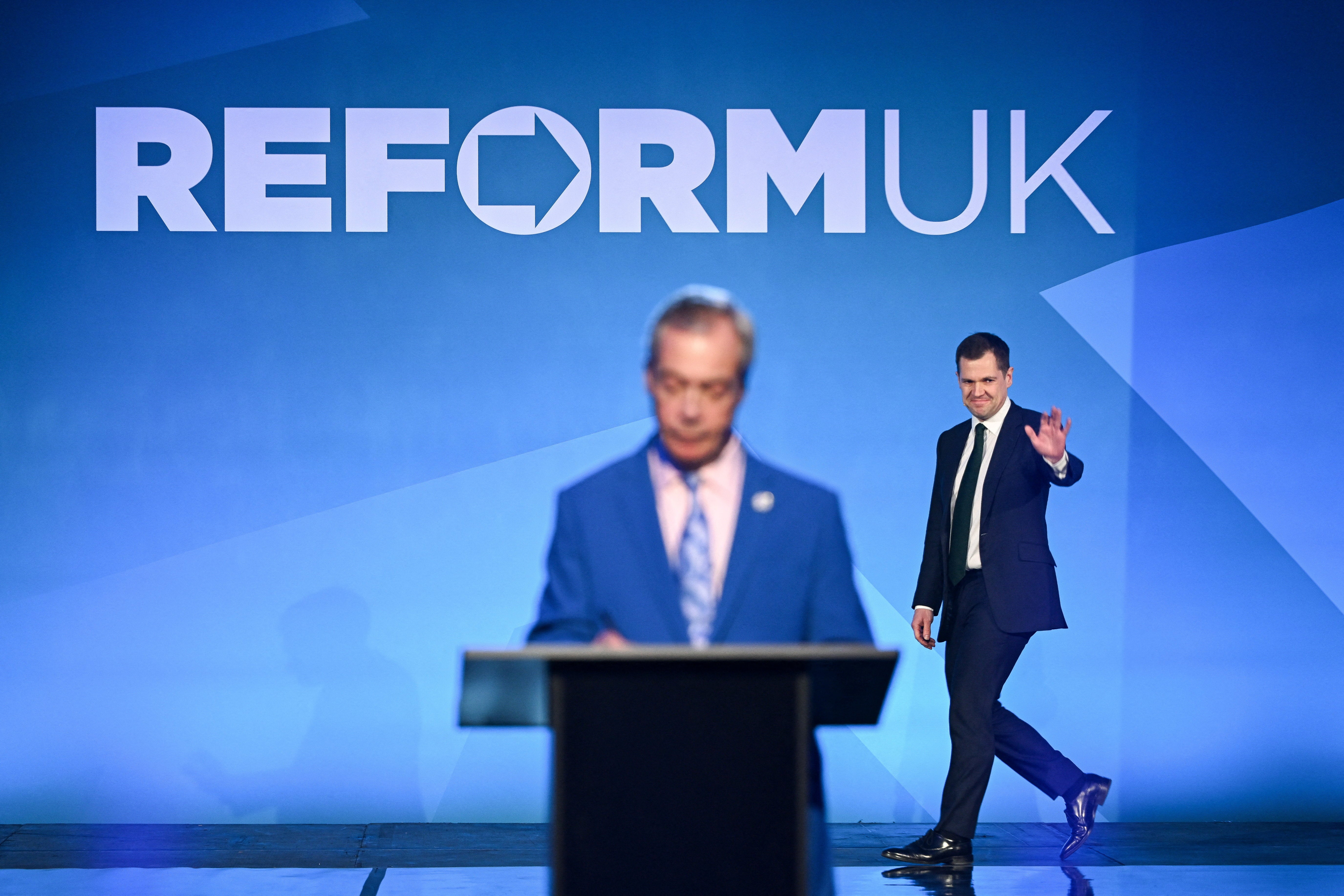 Robert Jenrick walks on the stage as he is being announced by Britain's Reform UK leader Nigel Farage as the party's ‘shadow chancellor of the Exchequer’