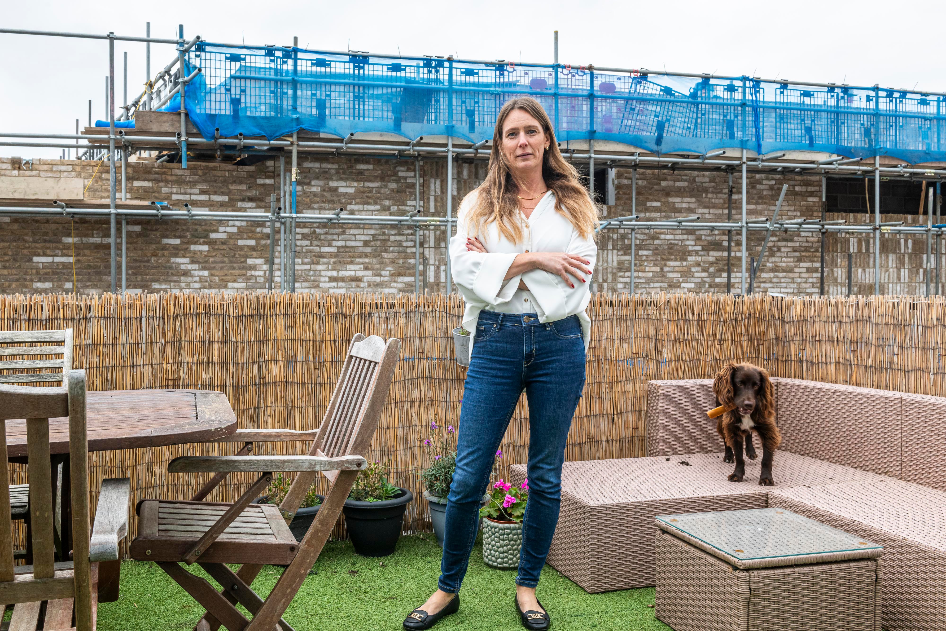 Liz Bates on her roof terrace opposite the wall