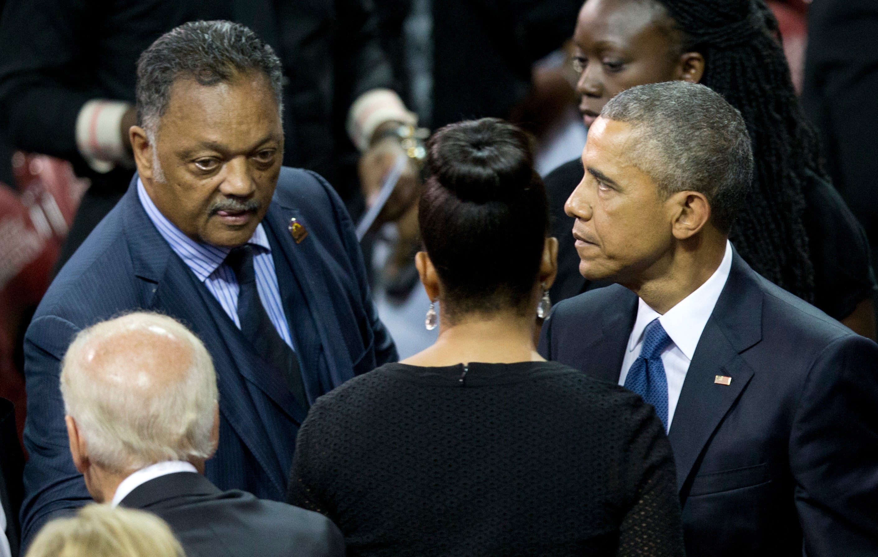 Vice President Joe Biden, Rev. Jesse Jackson, first lady Michelle Obama, and President Barack Obama gather after services honoring the life of Reverend Clementa Pinckney at the College of Charleston TD Arena in Charleston