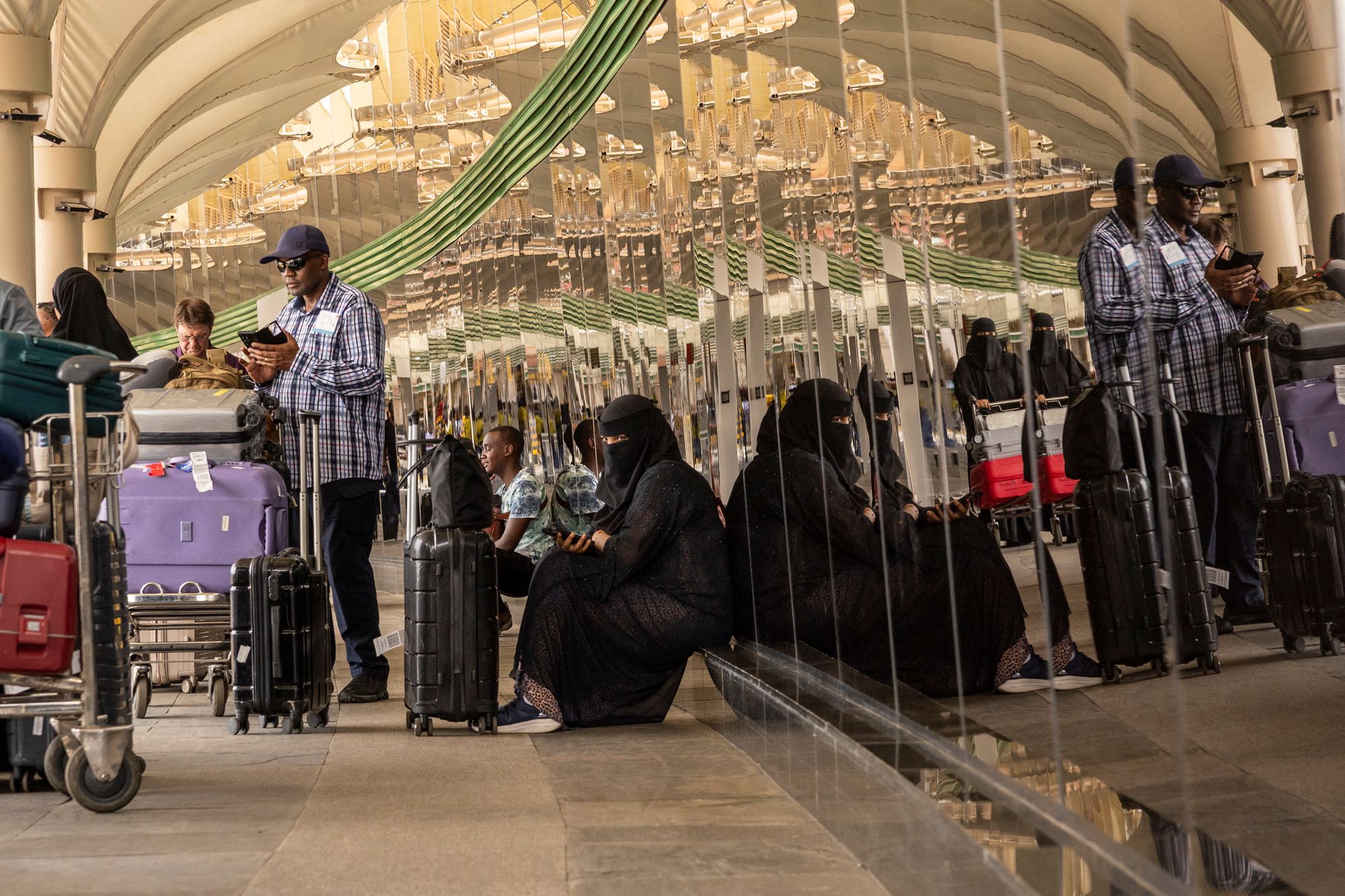 Passengers wait at a closed door at the departures of the Jomo Kenyatta International Airport (JKIA) in Nairobi