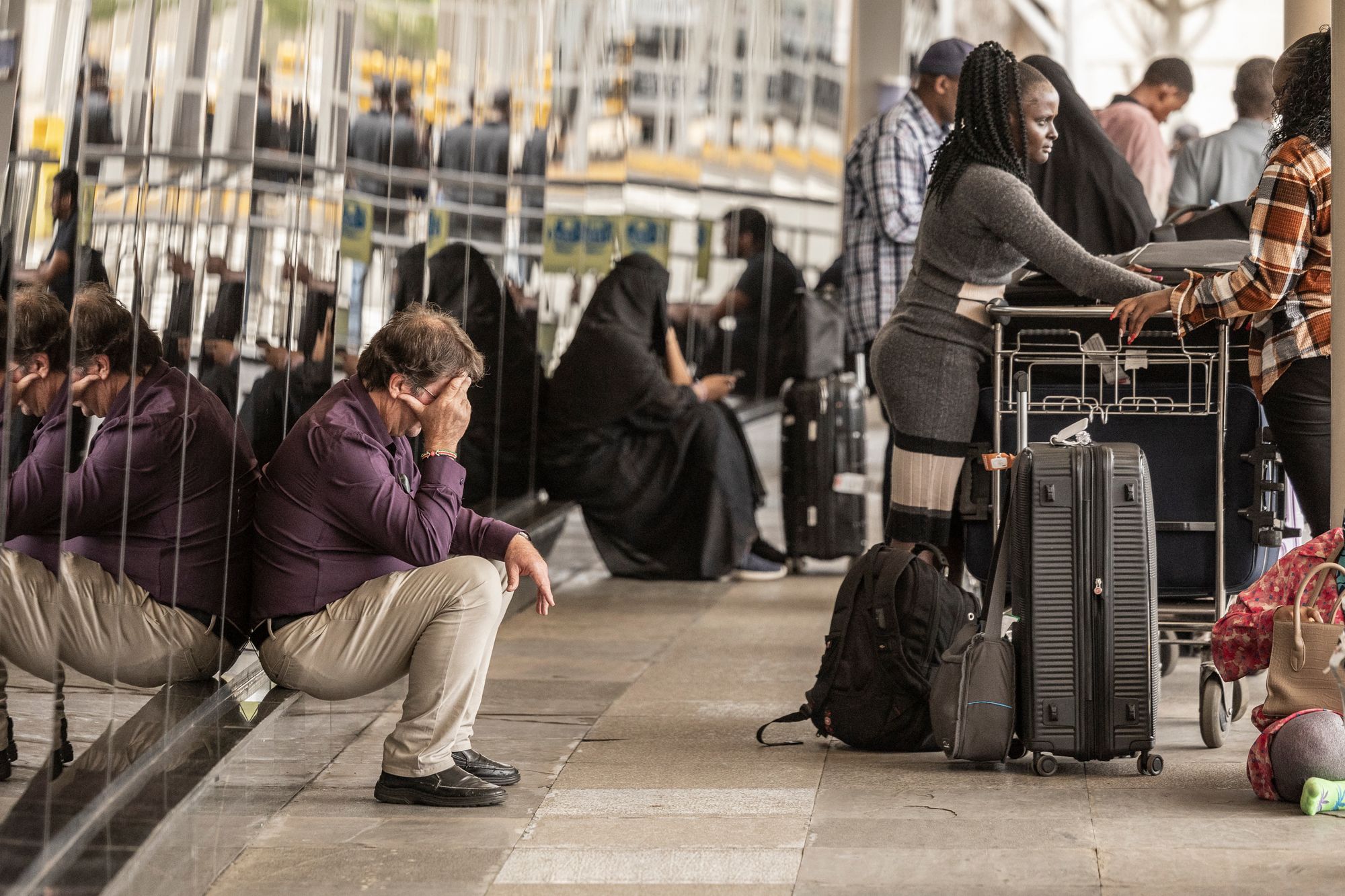 <p>Passengers wait with their luggages by the departure terminal of the Jomo Kenyatta International Airport (JKIA) in Nairobi on February 17, 2026 amid a strike by the Kenyan Aviation Workers Union</p>