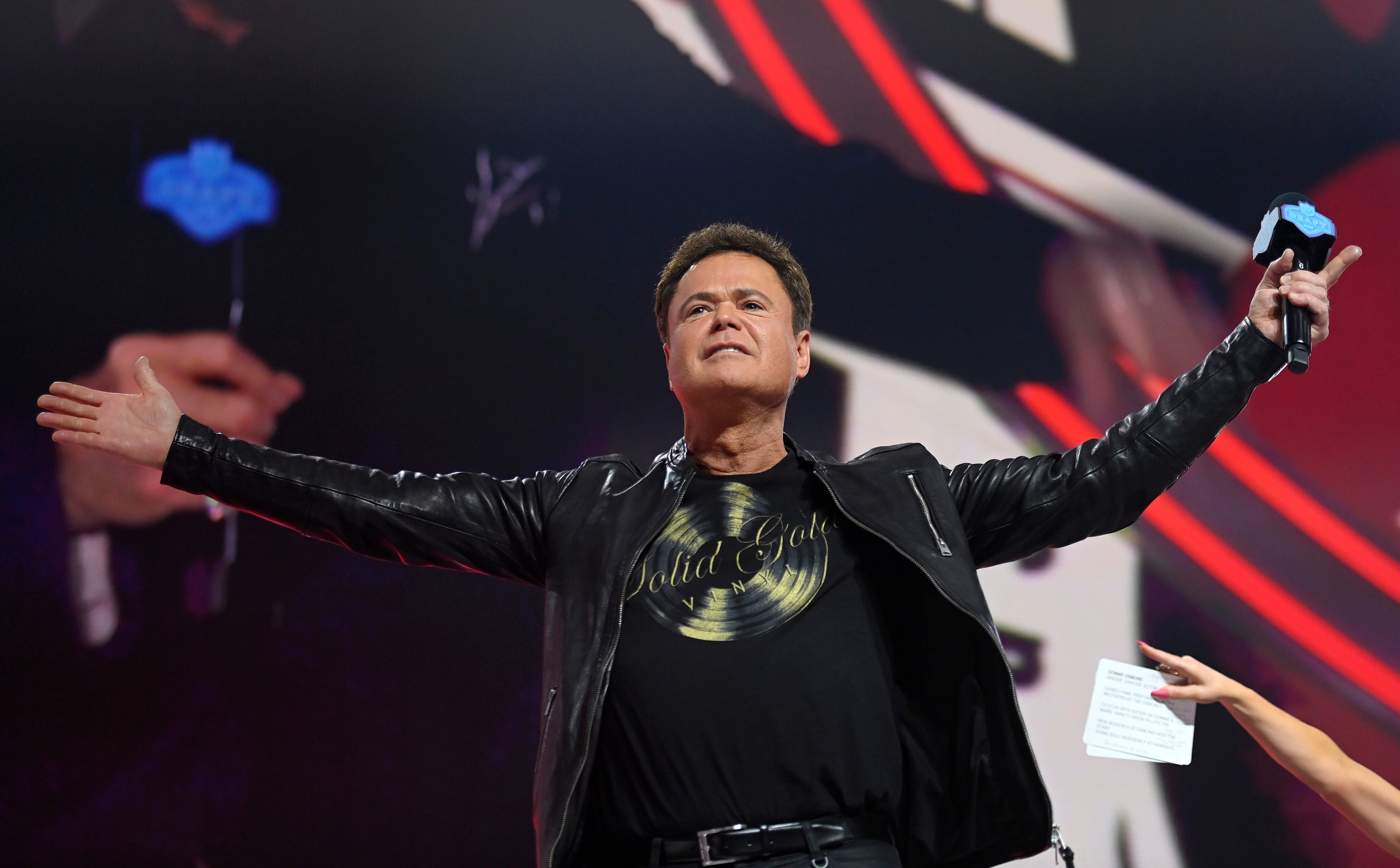 Donny Osmond and a Las Vegas casino are being sued by a tourist, who says she was struck in the head by a ‘Donny ball’