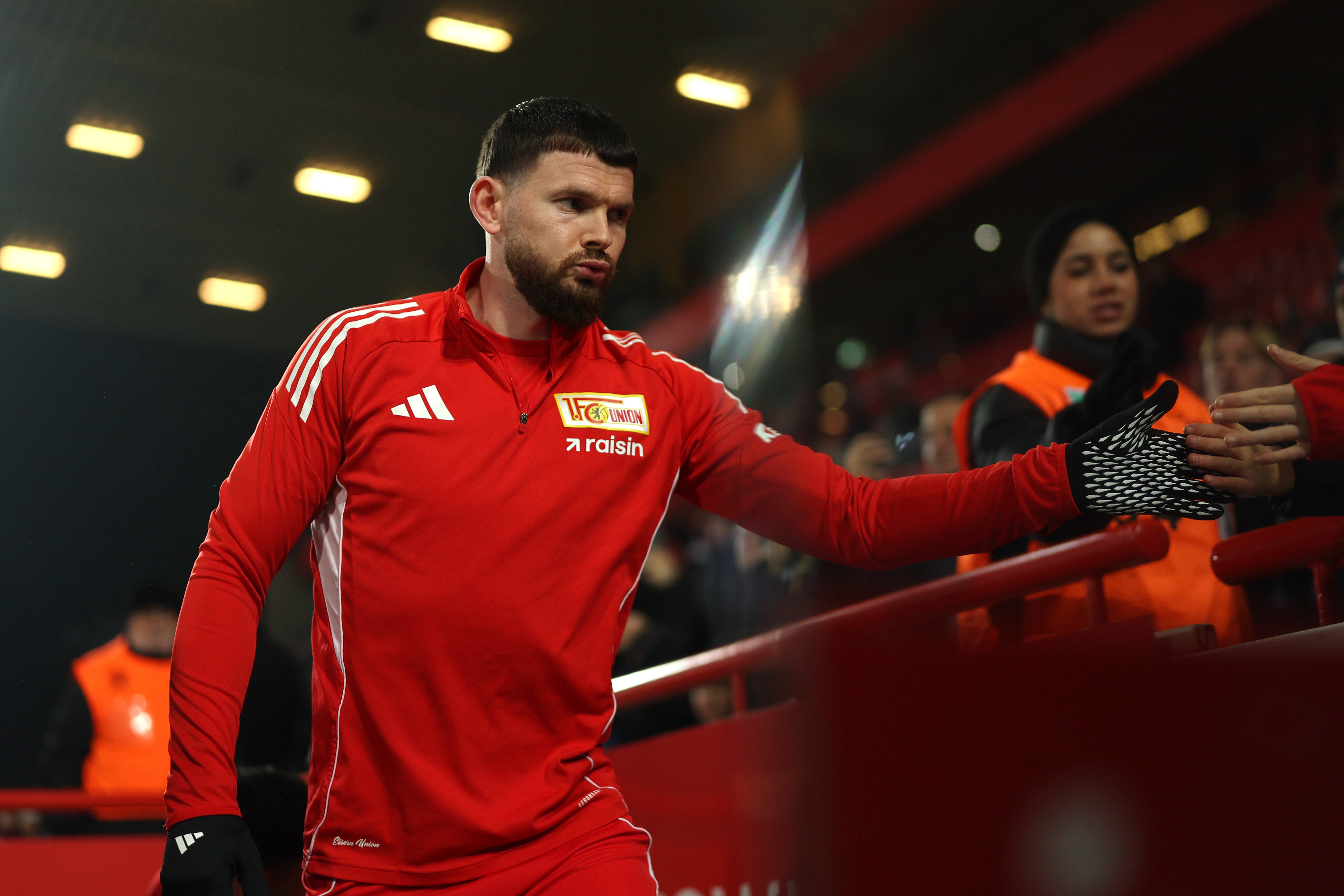 Oliver Burke of 1. FC Union Berlin interacts with fans