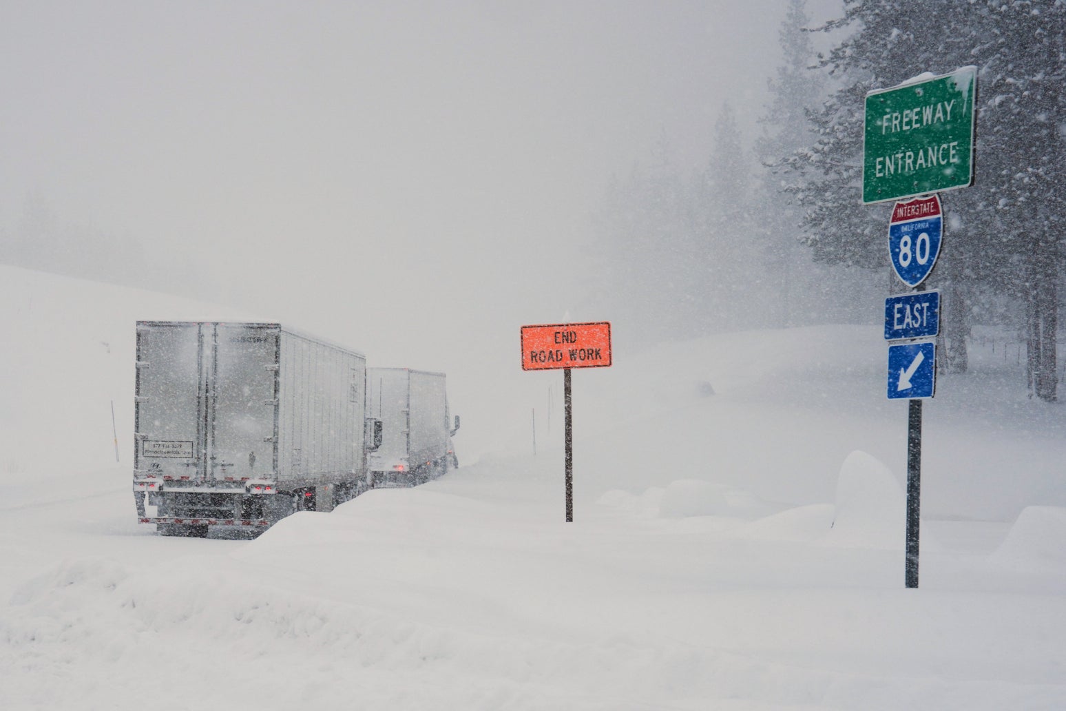 Trucks lined up along Interstate 80 during the snowstorm