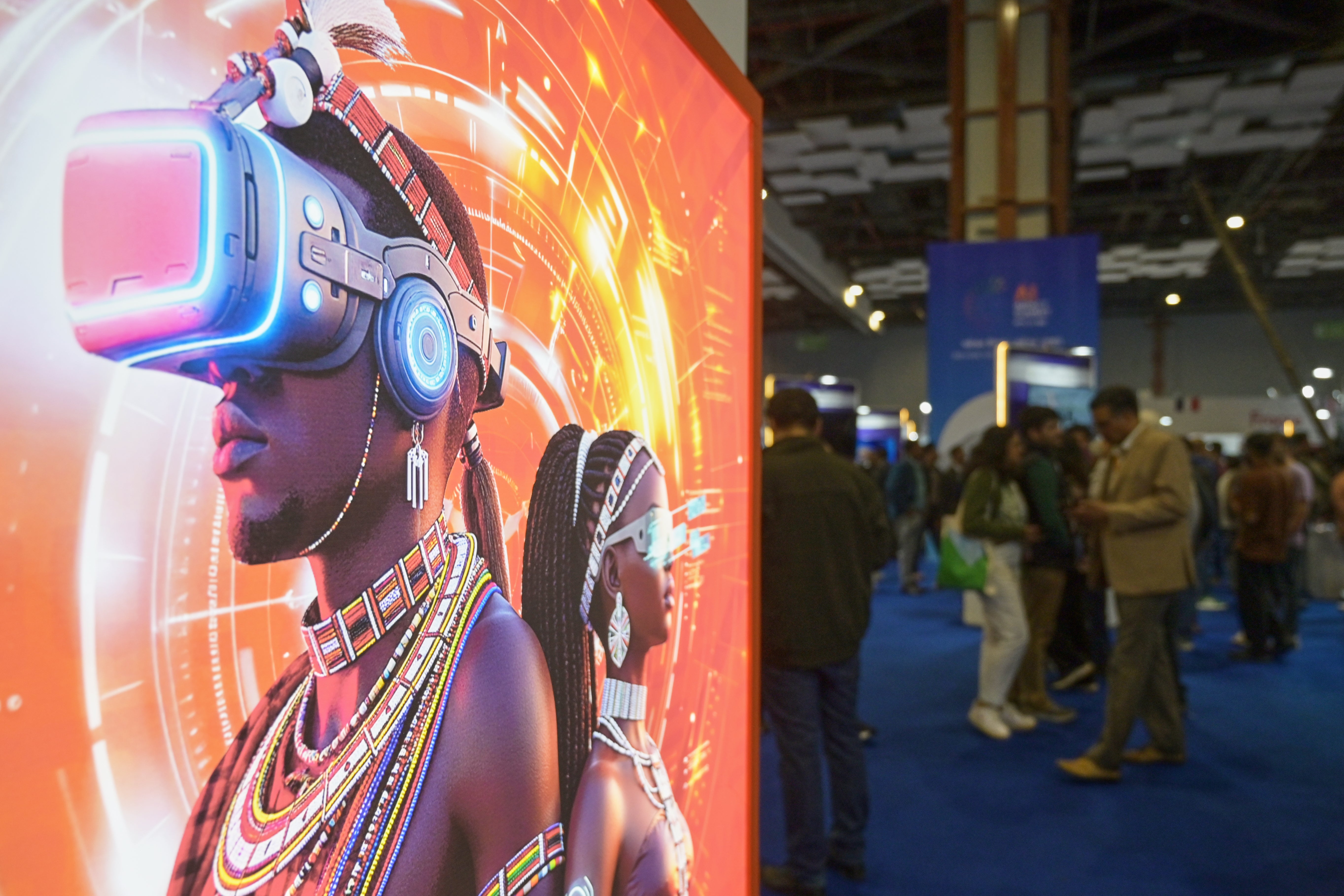 Visitors stand next to an advertising billboard at AI summit in New Delhi, India