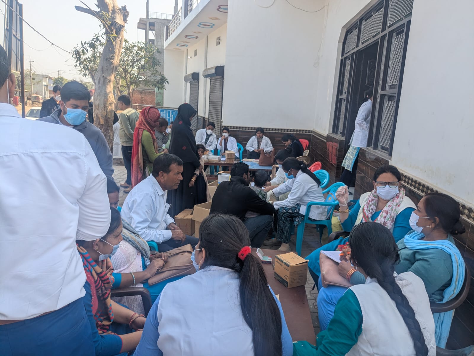 Healthcare workers screen villagers for hepatitis B and C at a medical camp in Chhainsa