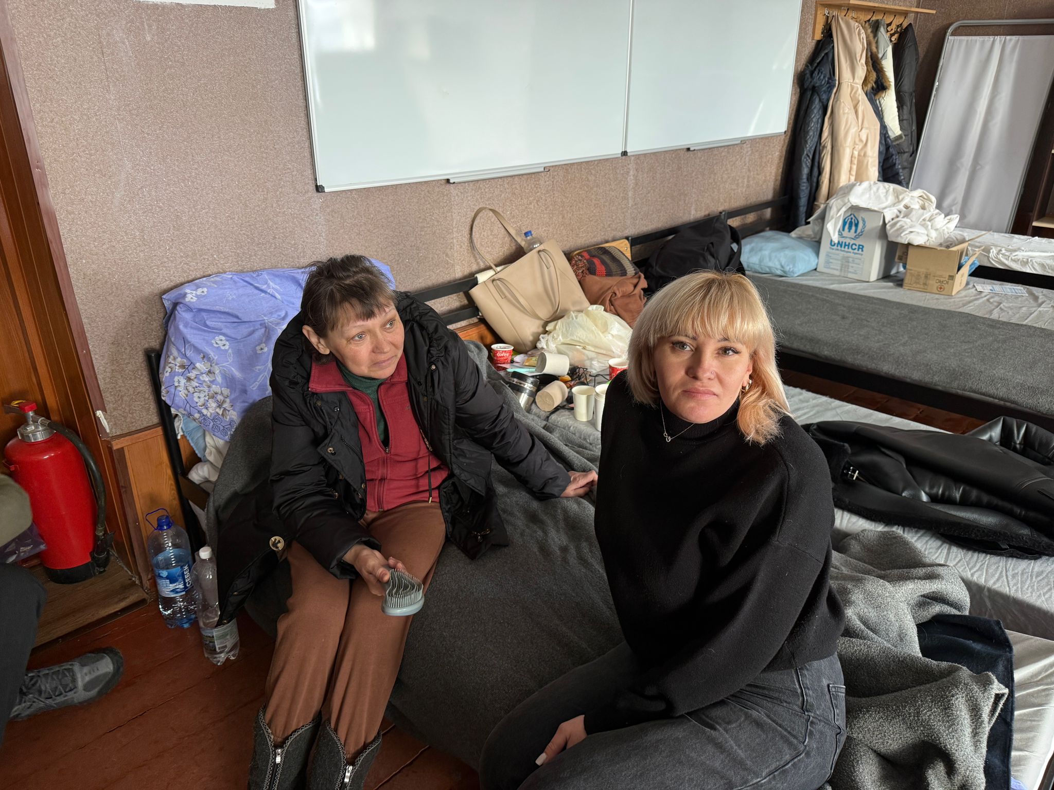 Iryna Nemchenko (left) fled Dobropillia after her husband Oleh was killed