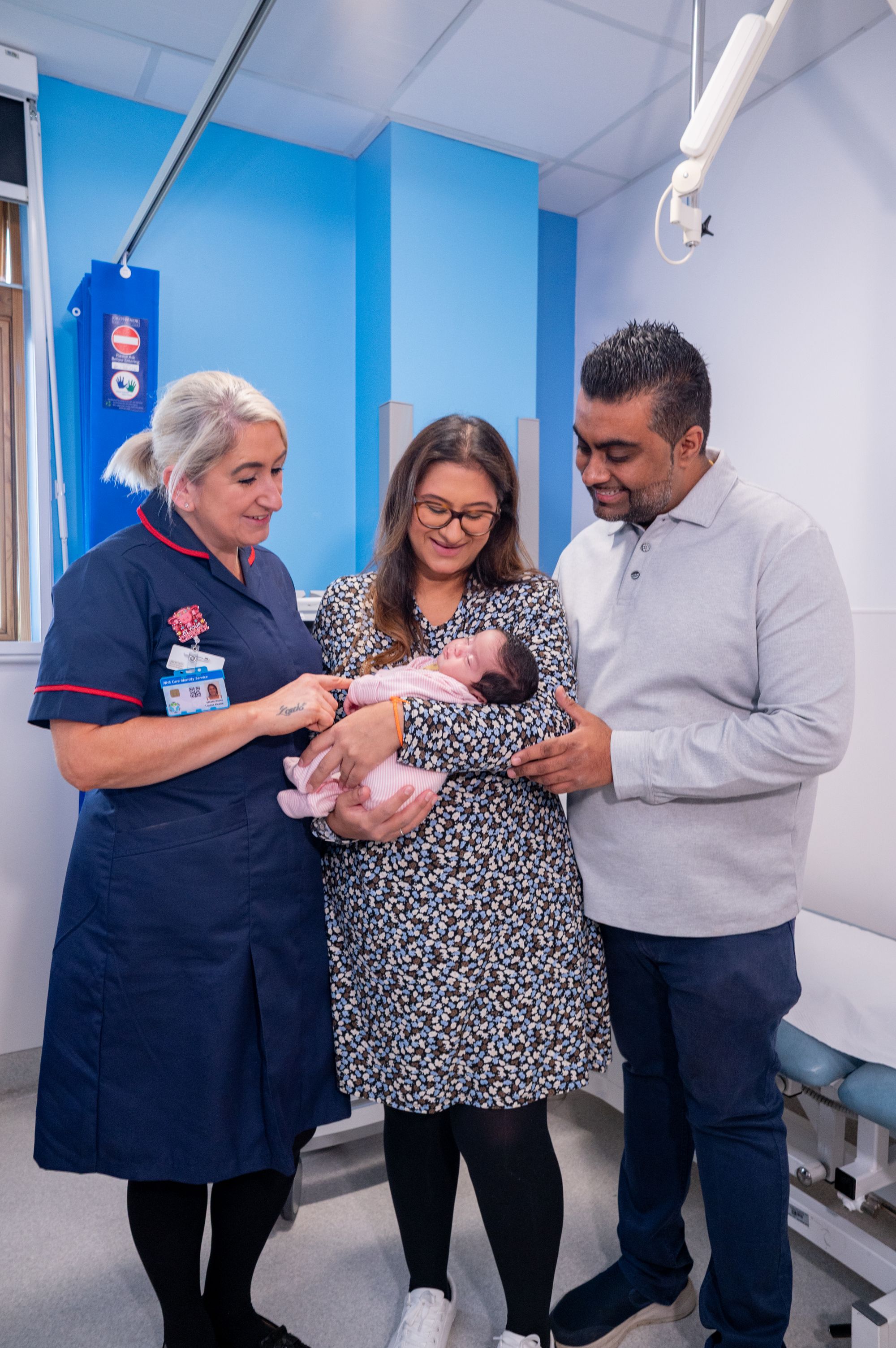 Ms Adhia with her husband Nik, 37, and baby daughter Ishaani