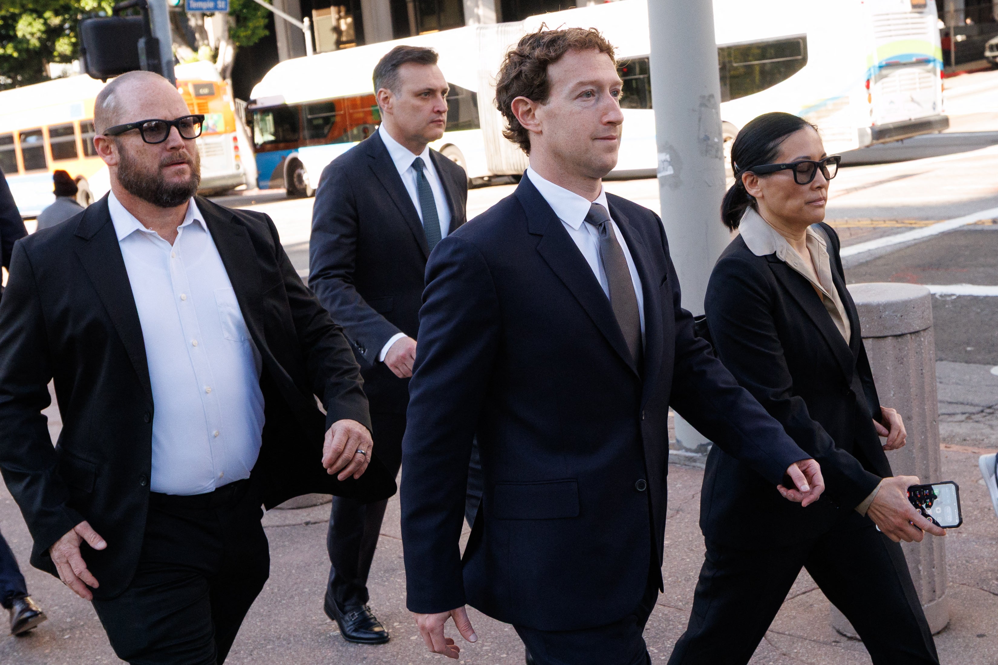 Zuckerberg was flanked by several individuals who appeared to be part of his security detail