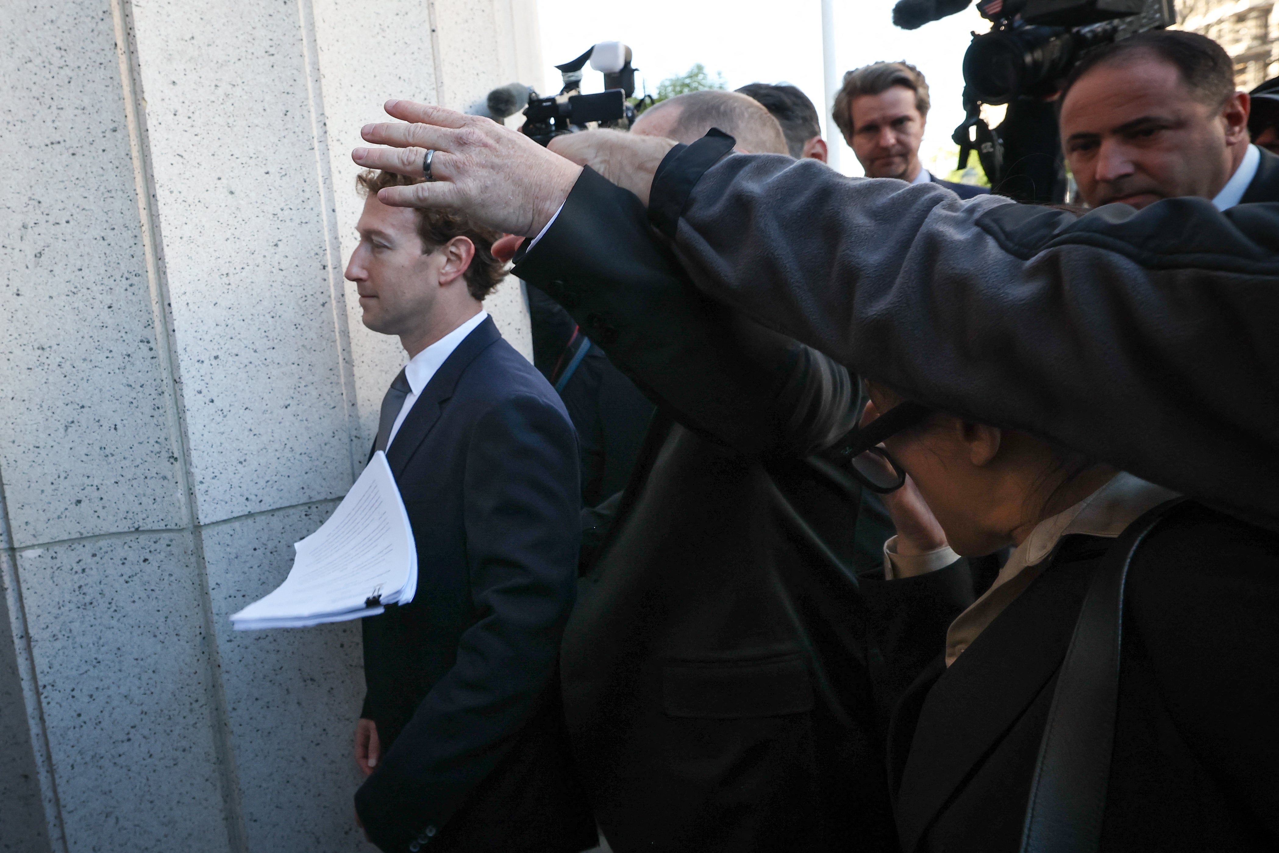 Outside the courthouse, a man attempted to hand papers to the Meta CEO, while stating, 'Mark Zuckerberg, you've been served'