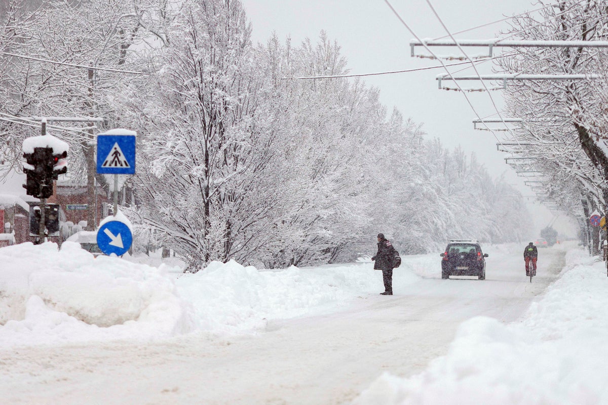 Schools closed and trains delayed after snowstorm in Romania
