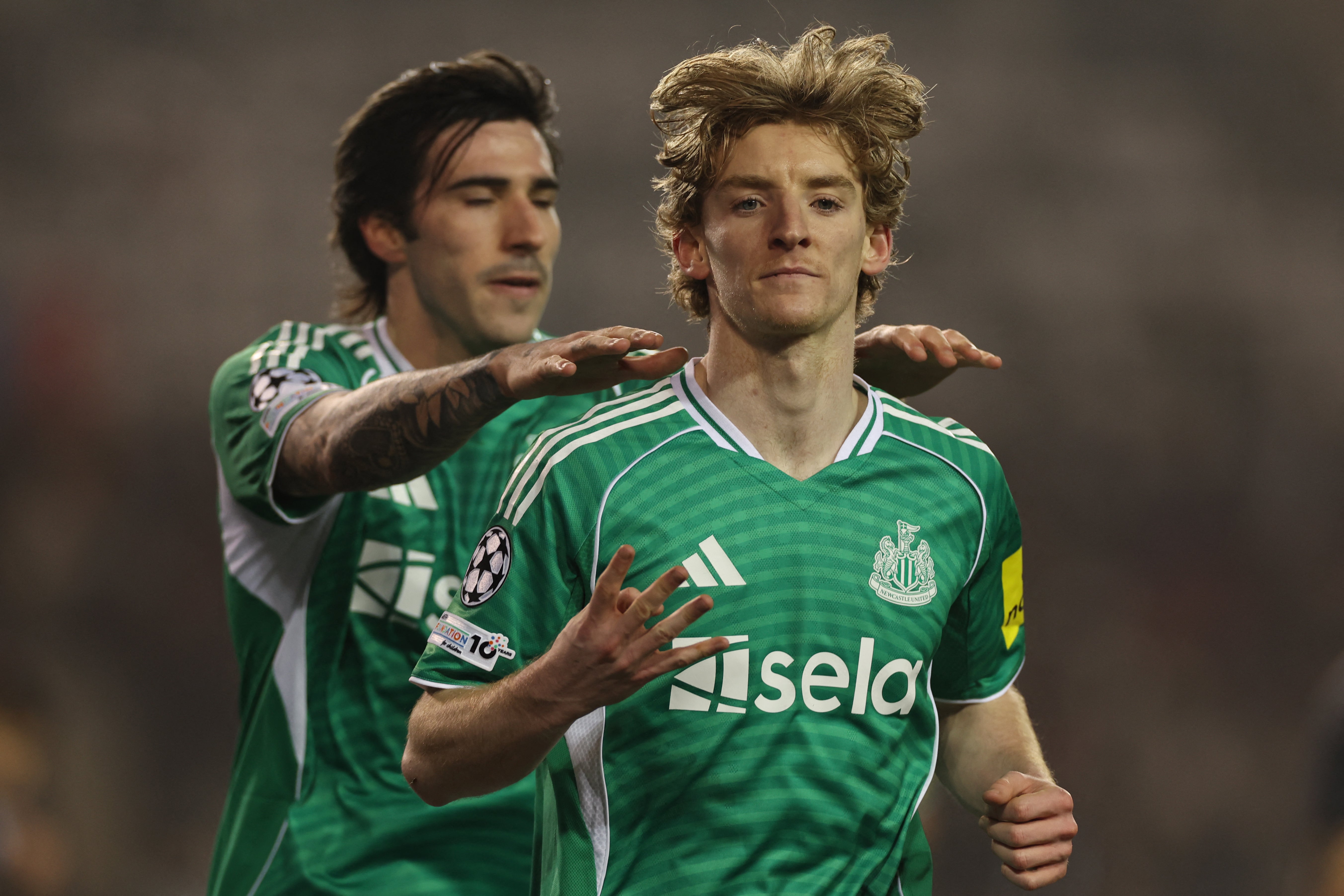 Newcastle United's English midfielder #10 Anthony Gordon celebrates scoring the team's fifth goal from the penalty spot