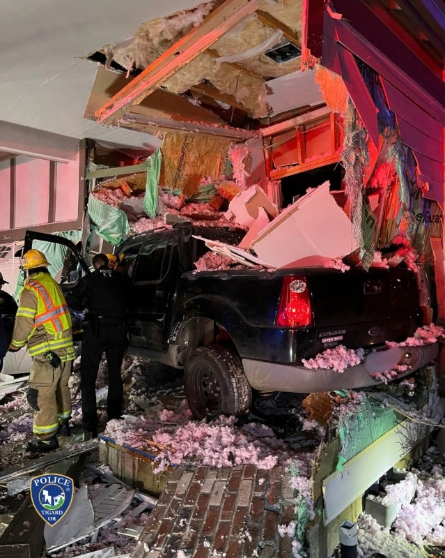 Jacob Hankins, 33, was charged with reckless driving and recklessly endangering after police say he crashed his truck into the home in Tigard, near Portland, last Friday