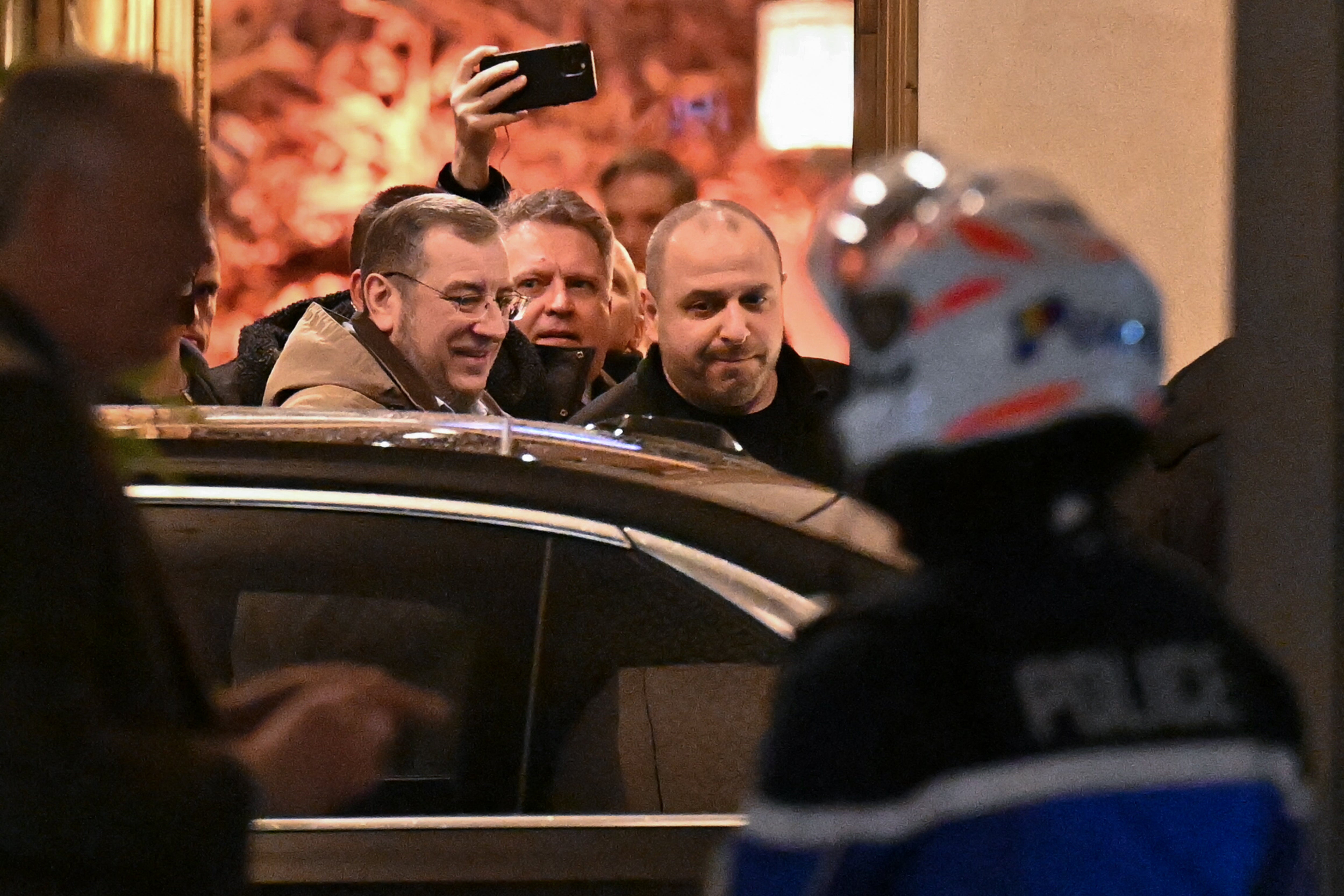 Rustem Umerov (R) leaves the Intercontinental hotel on Tuesday