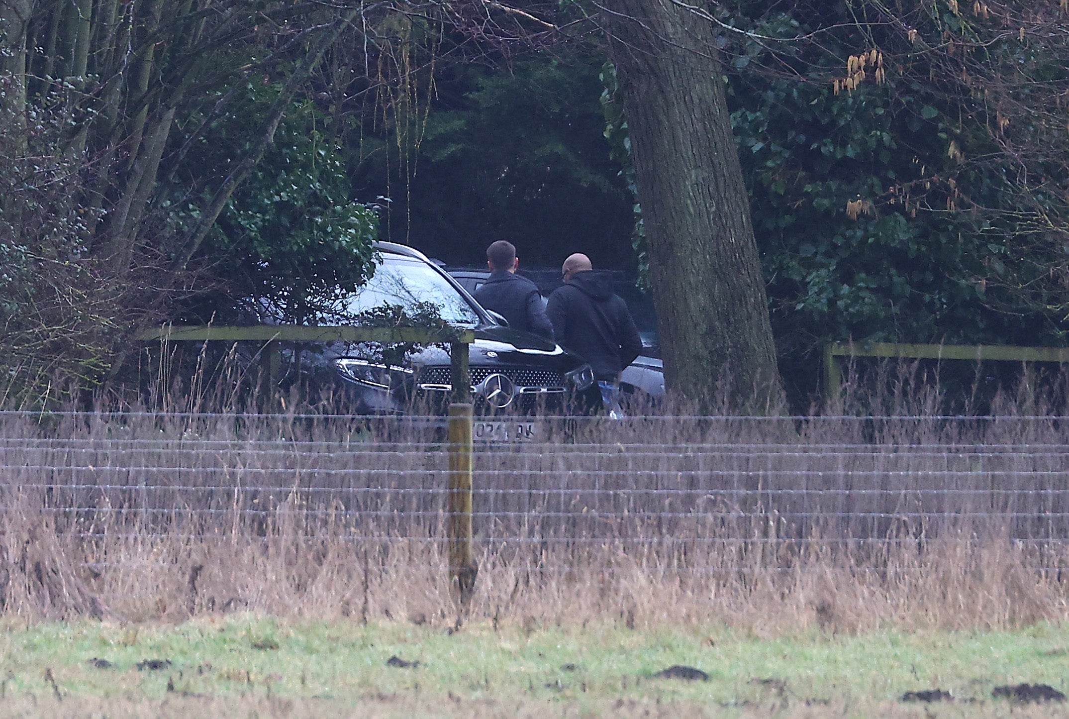 Men step out of an unmarked car at Mr Mountbatten-Windsor’s home on Thursday in Sandringham, Norfolk