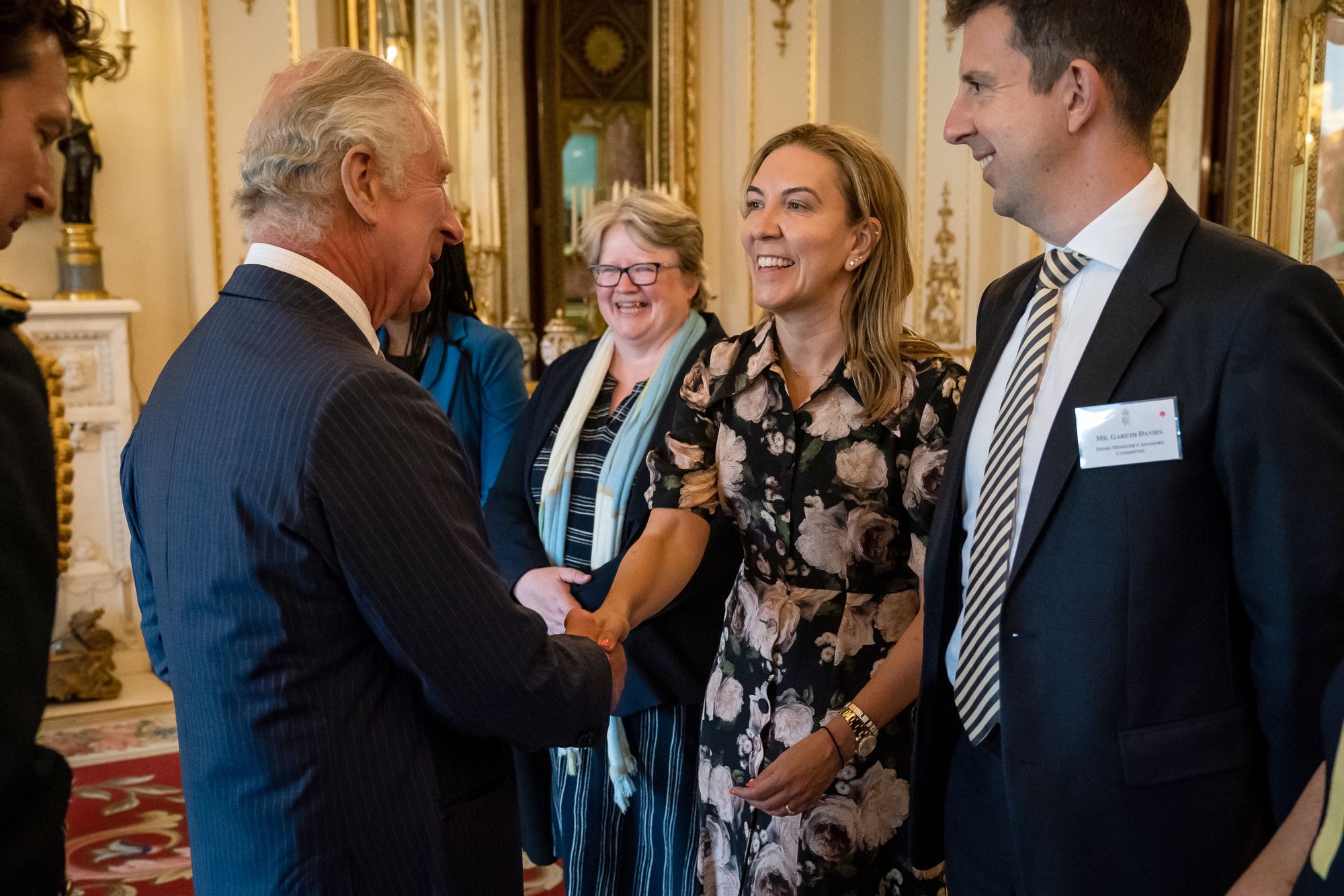King Charles III greets the Permanent Secretary of the Ministry of Justice, Antonia Romeo at Buckingham Palace in London