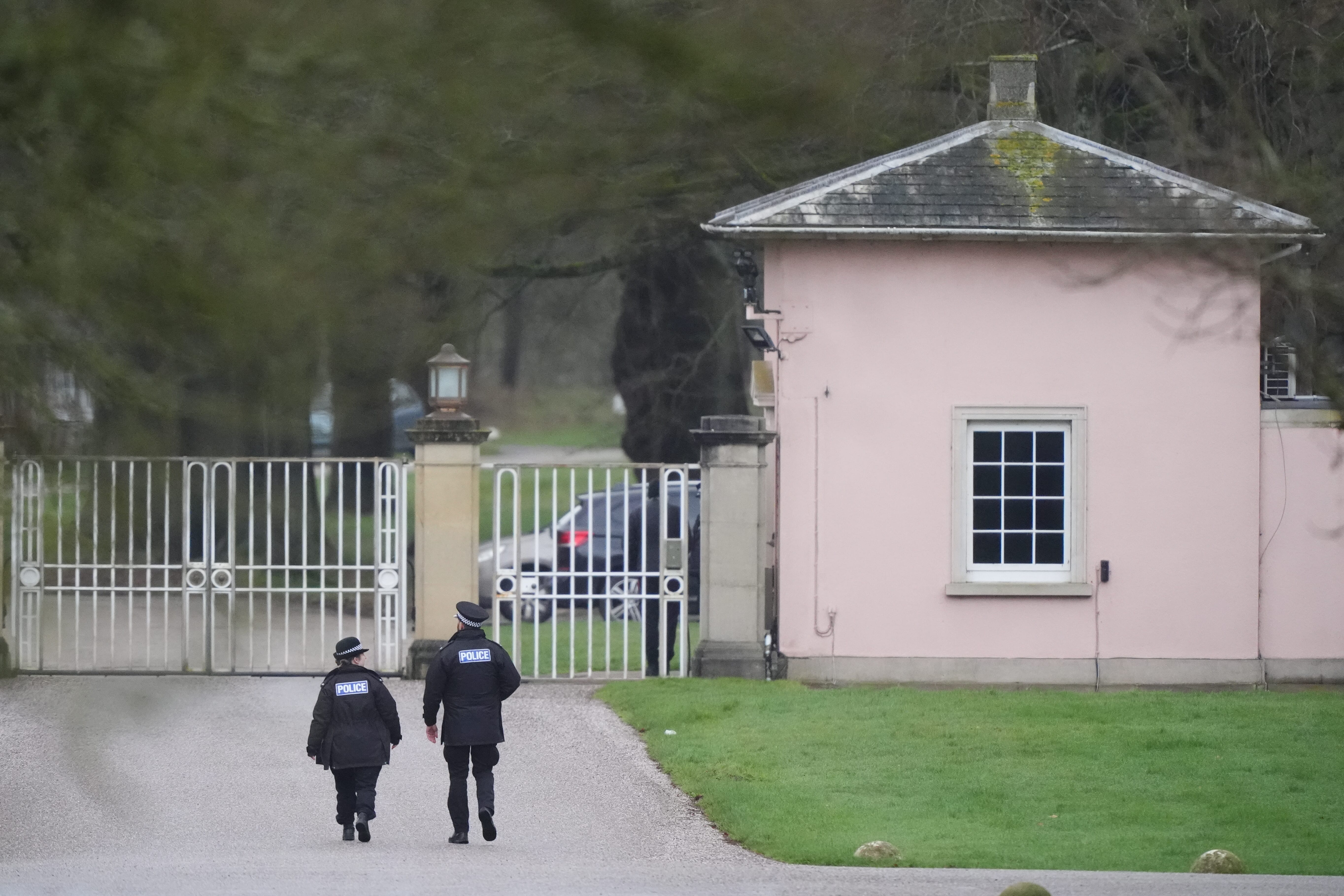 Police officers at Royal Lodge, the former home of Andrew Mountbatten-Windsor in Windsor, Berkshire (Jonathan Brady/PA)