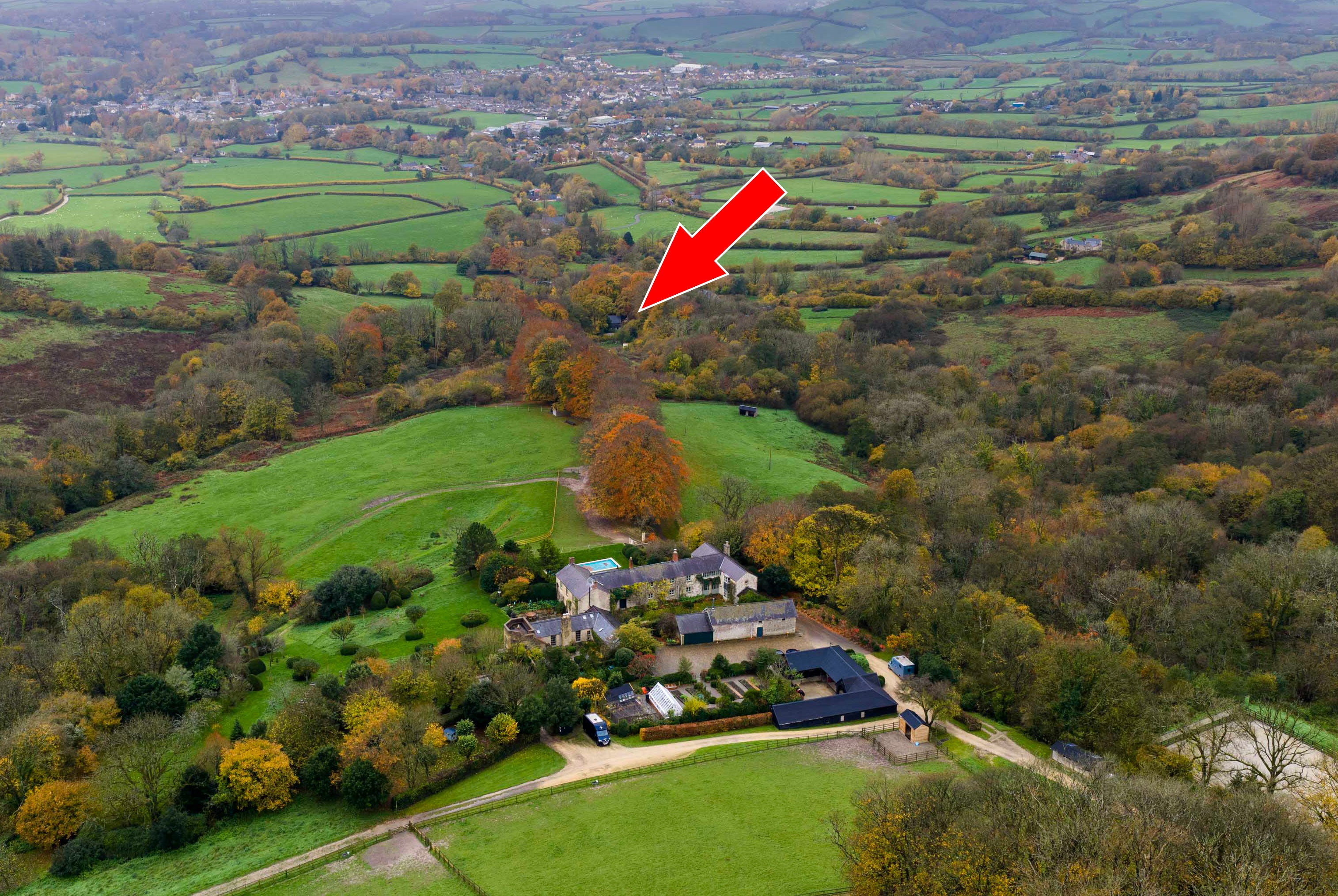 View showing Martin Clunes house at the bottom and Theo Langton's woodland travellers site at the middle top of the image