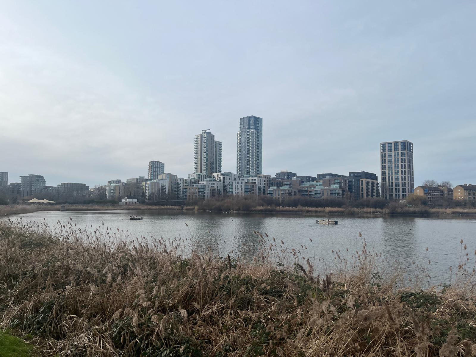 Riverside Apartments is part of the Woodberry Down development on the bank of Woodberry Wetlands. Images shows development on other side of reservoir