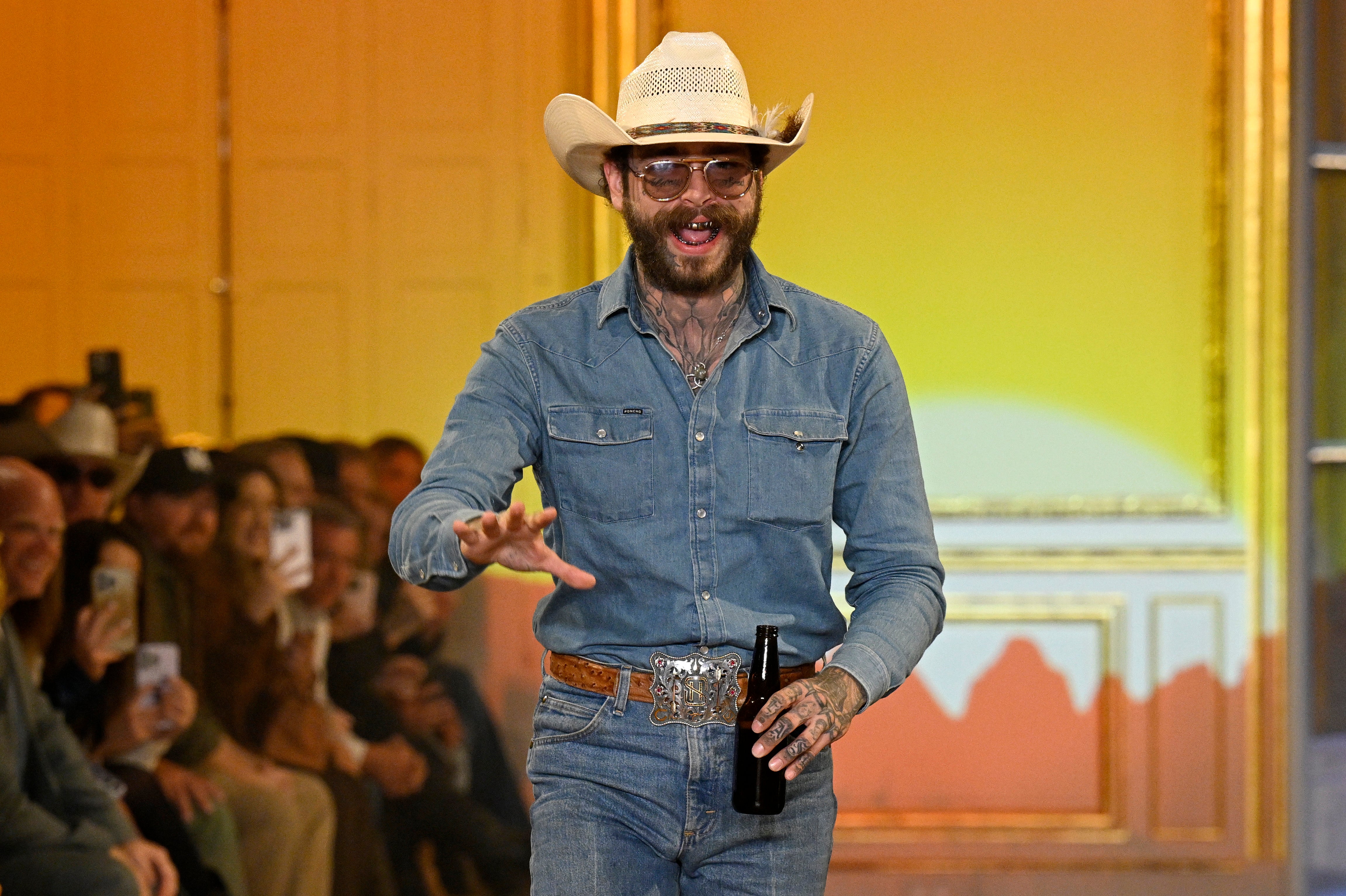 Rapper Post Malone appears at the first runway show for his Western-meets-streetwear brand, Austin Post
