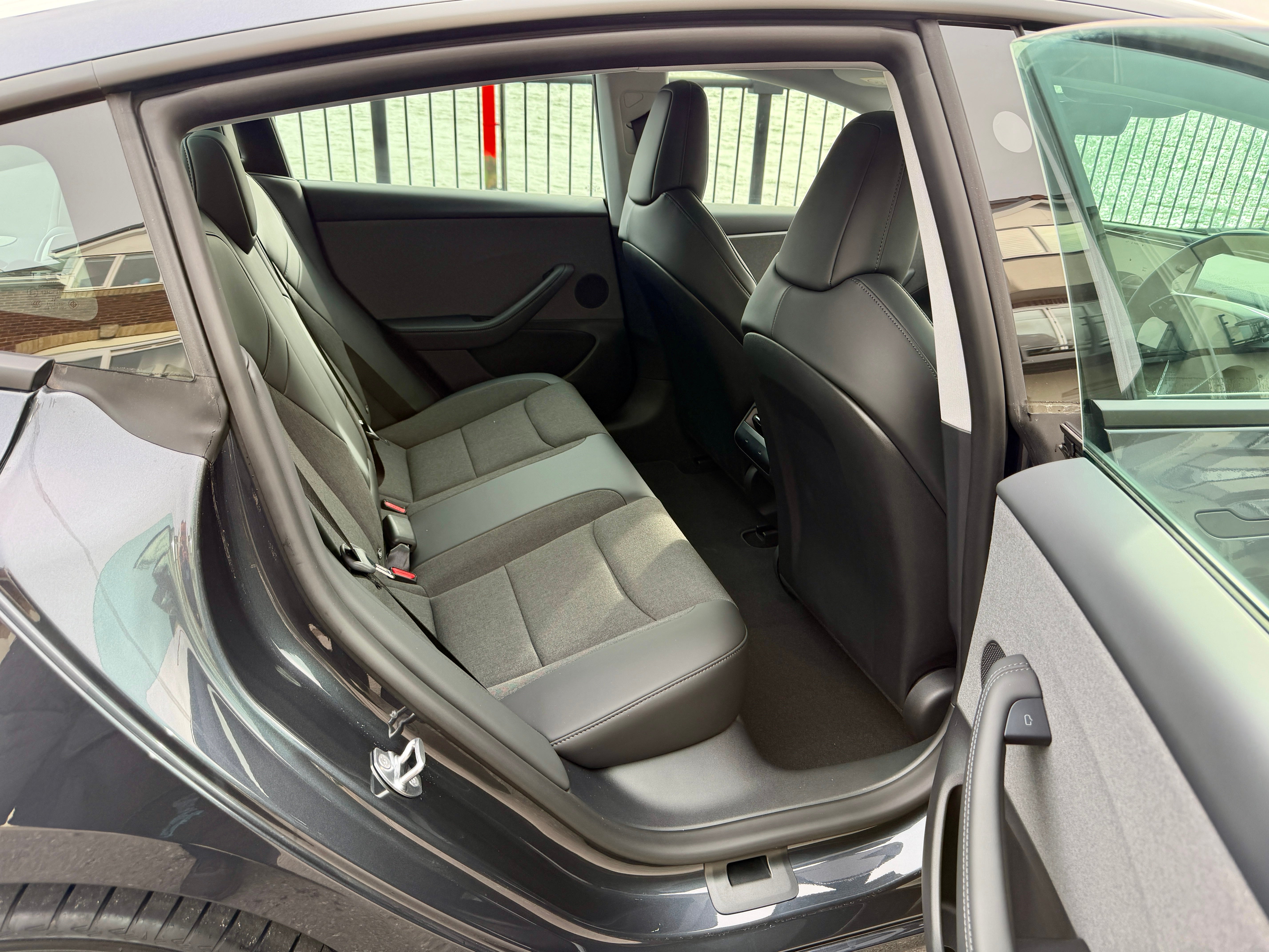 Rear space in the Tesla Model 3 Rear Wheel Drive is impressive, as is the view out and up – the latter thanks to a full-length glass roof