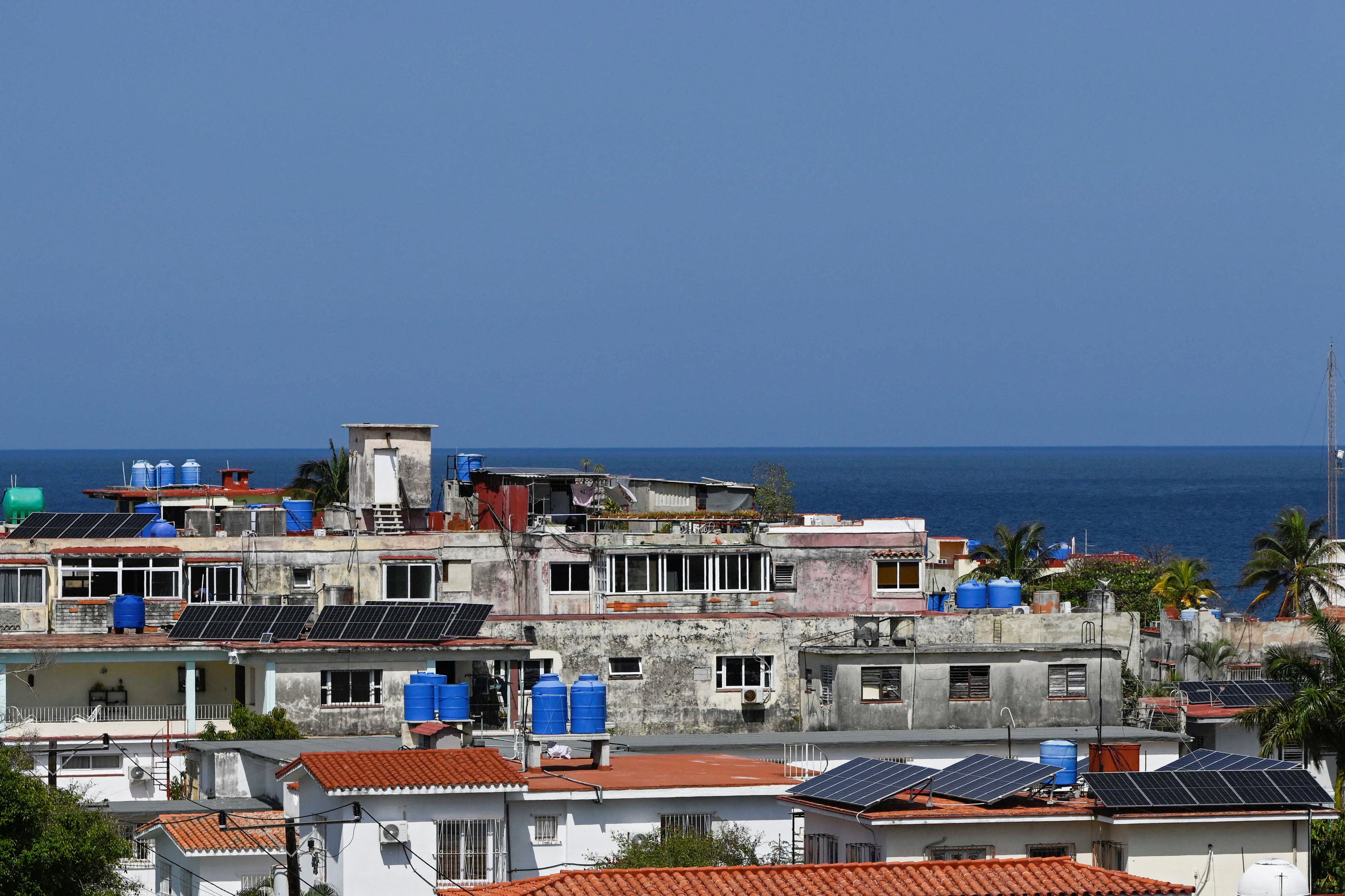 Solar panels are put on the rooftops of buildings as Cubans grapple with an ongoing energy crisis exacerbated by fuel shortages