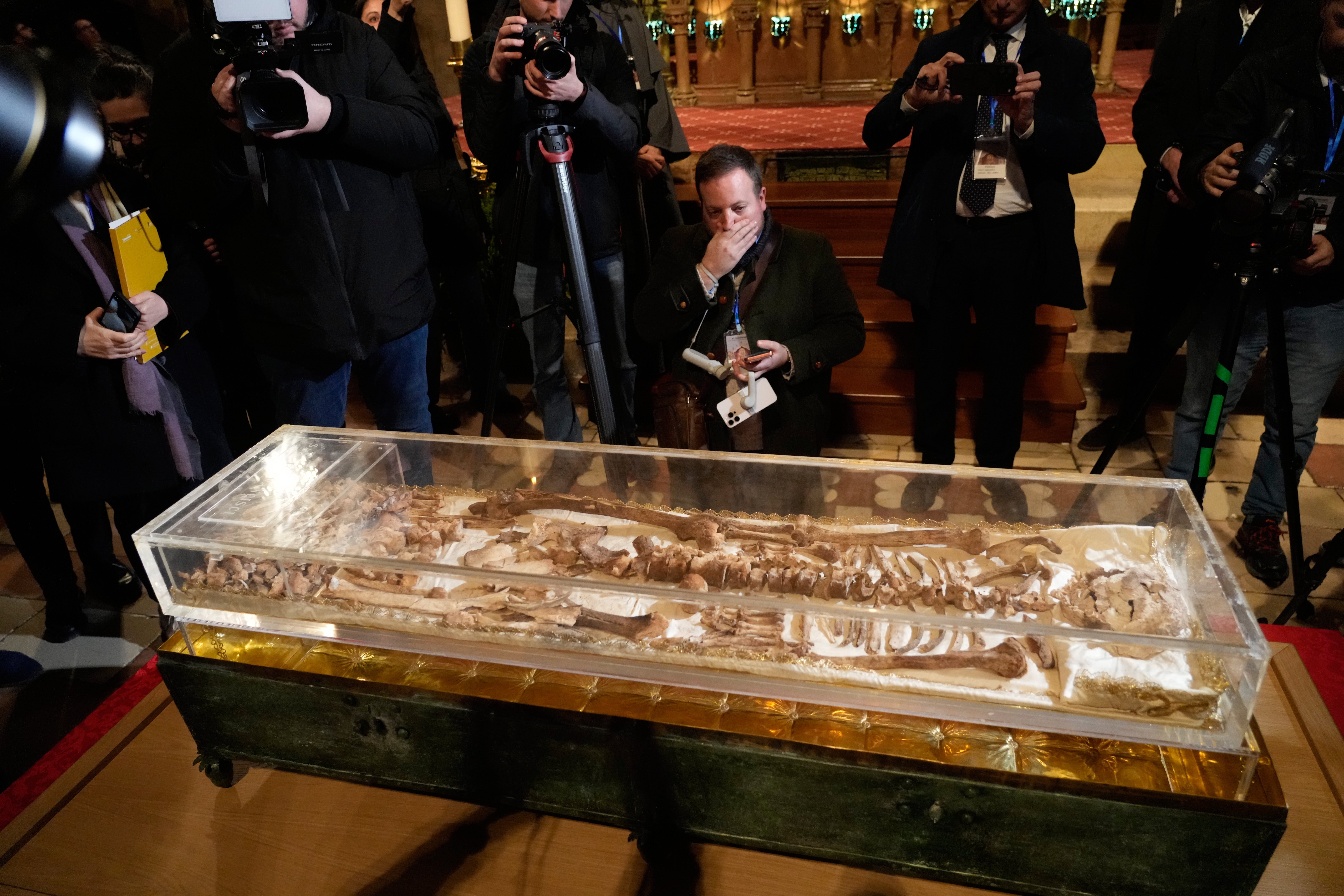 Journalists view the remains of St Francis of Assisi before they go on public display