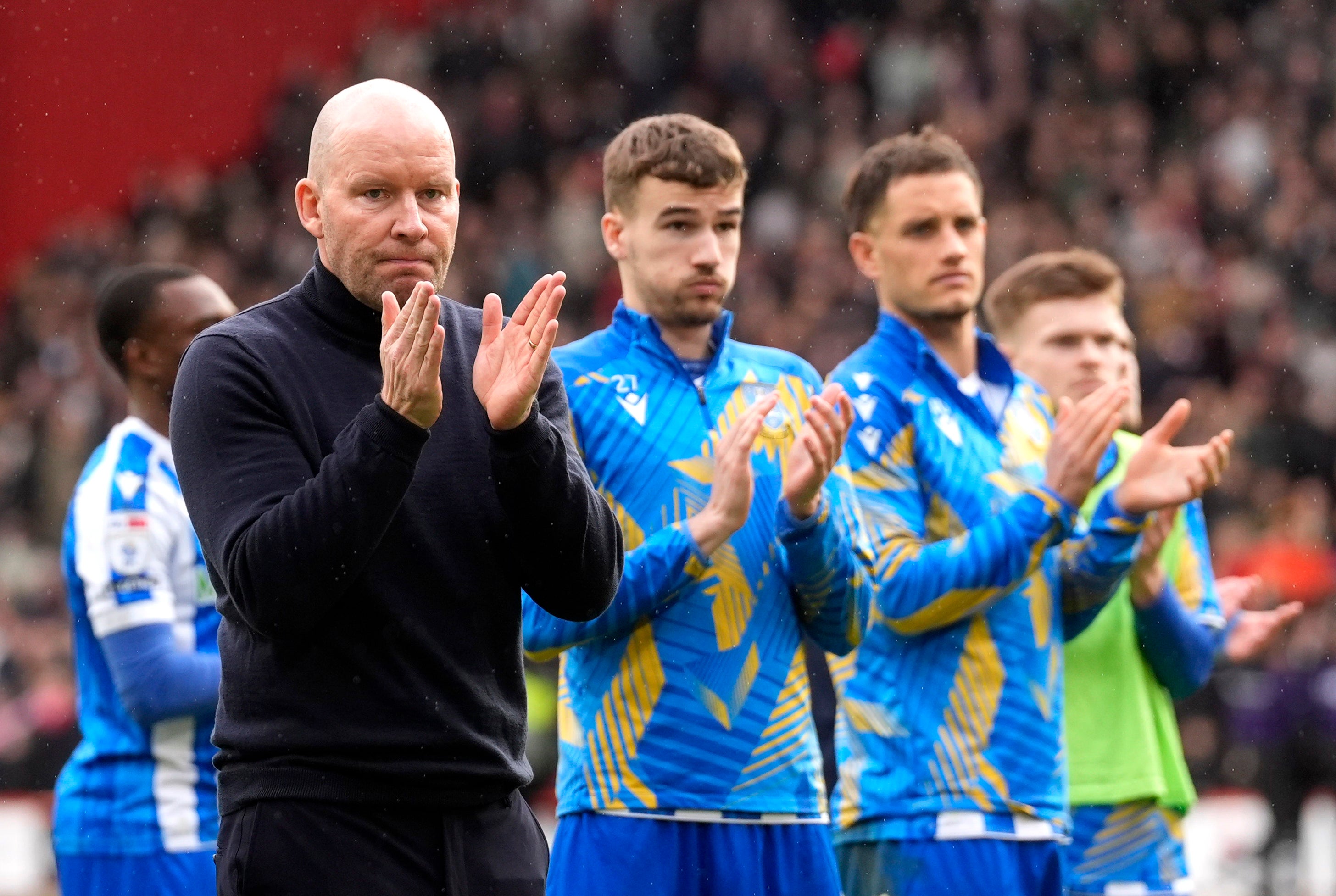 Sheffield Wednesday manager Henrik Pedersen applauds the fans