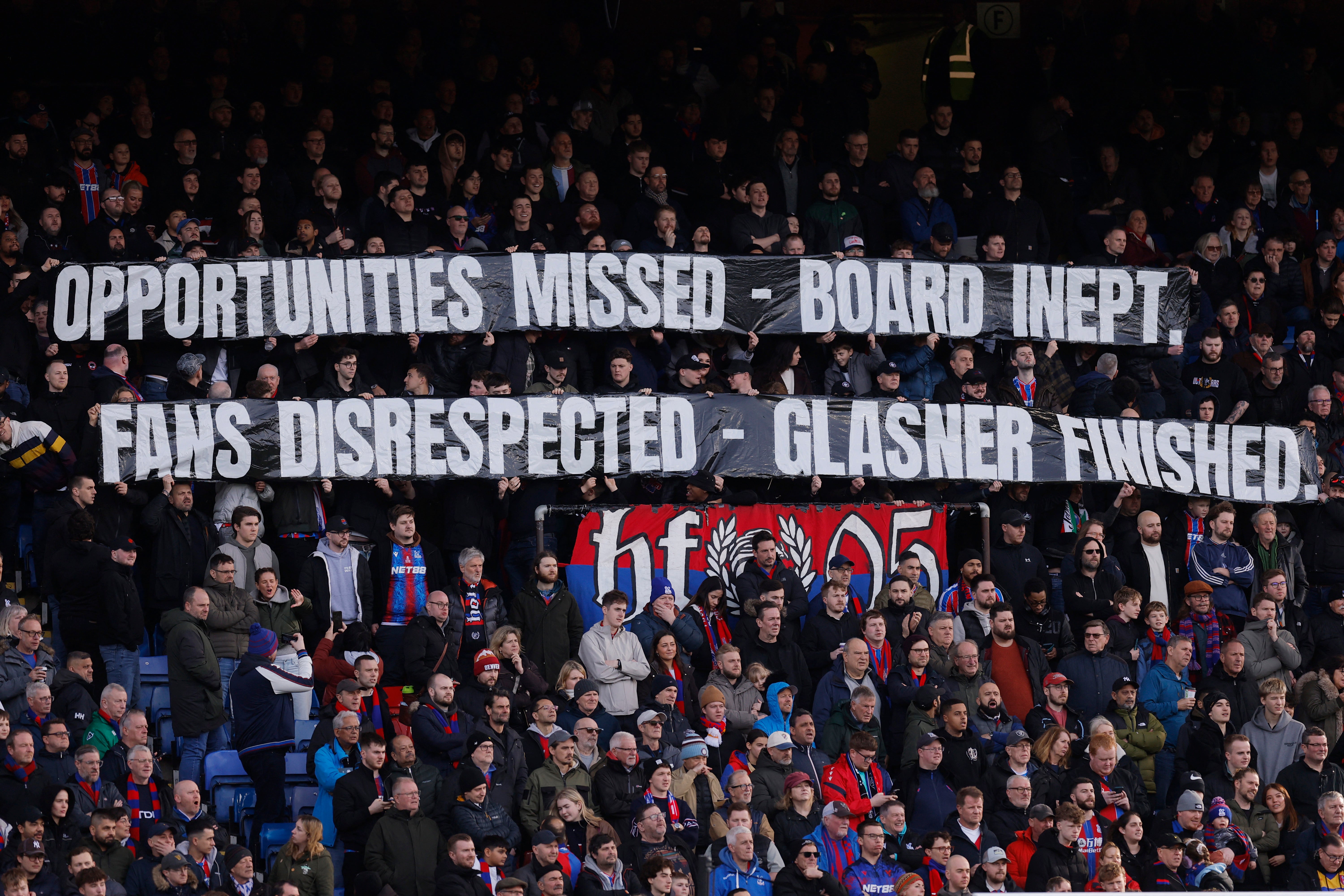 Crystal Palace fans with a banner in protest to ownership and manager Oliver Glasner