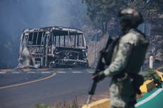 Mexico fears more violence as tourists warned and schools closed following killing of powerful cartel boss