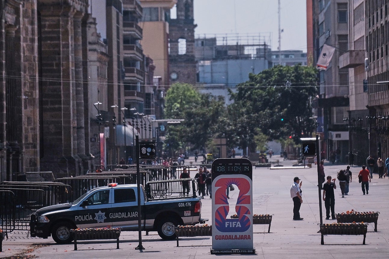 Police officers stand guard in downtown Guadalajara