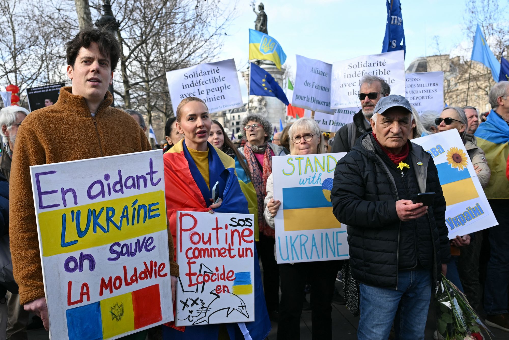People take part in a march for Ukraine ahead of the fourth anniversary of Russia's invasion, in Paris