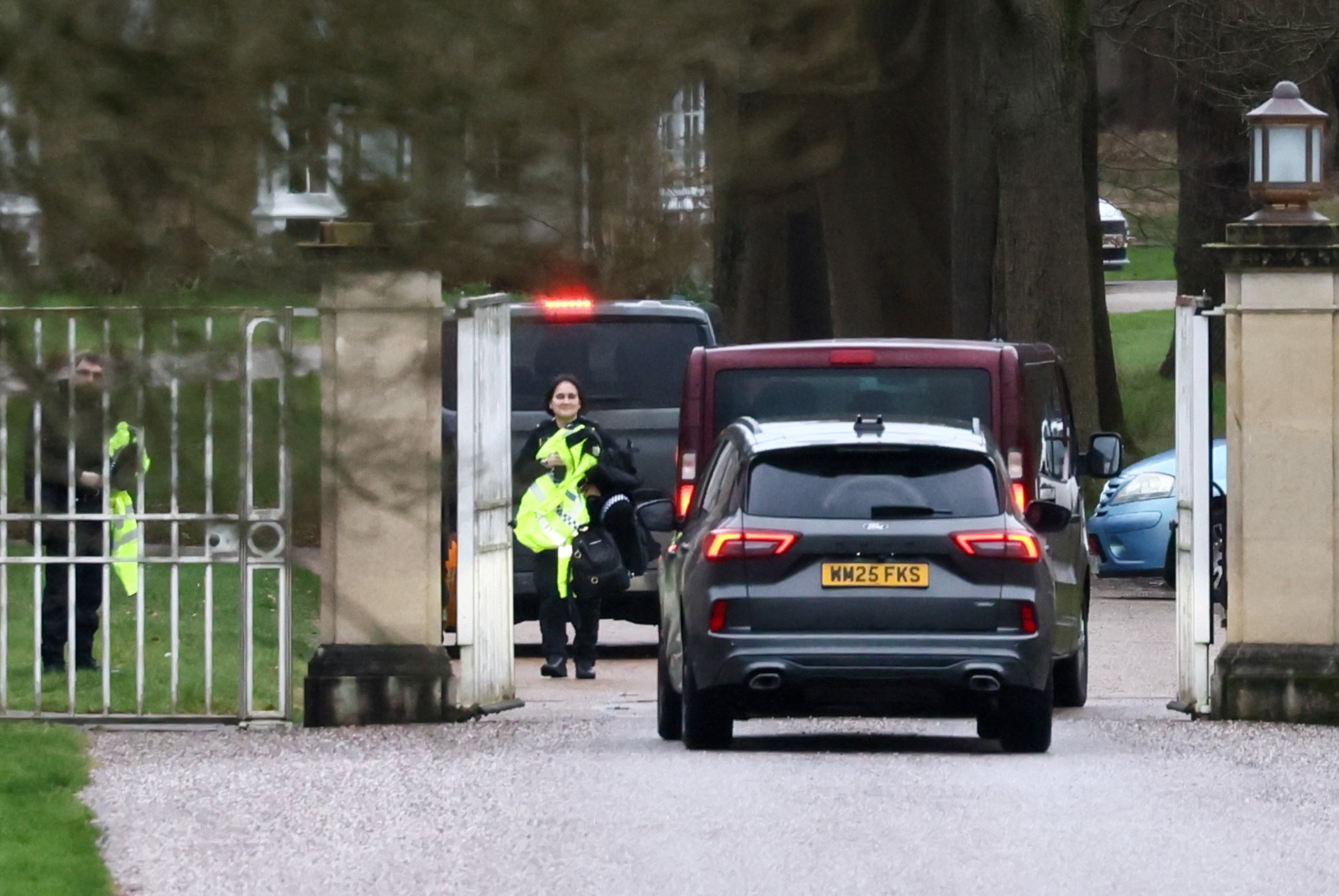 Unmarked police cars drive into Royal Lodge as Andrew Mountbatten-Windsor was released under investigation following arrest on suspicion of misconduct in public office