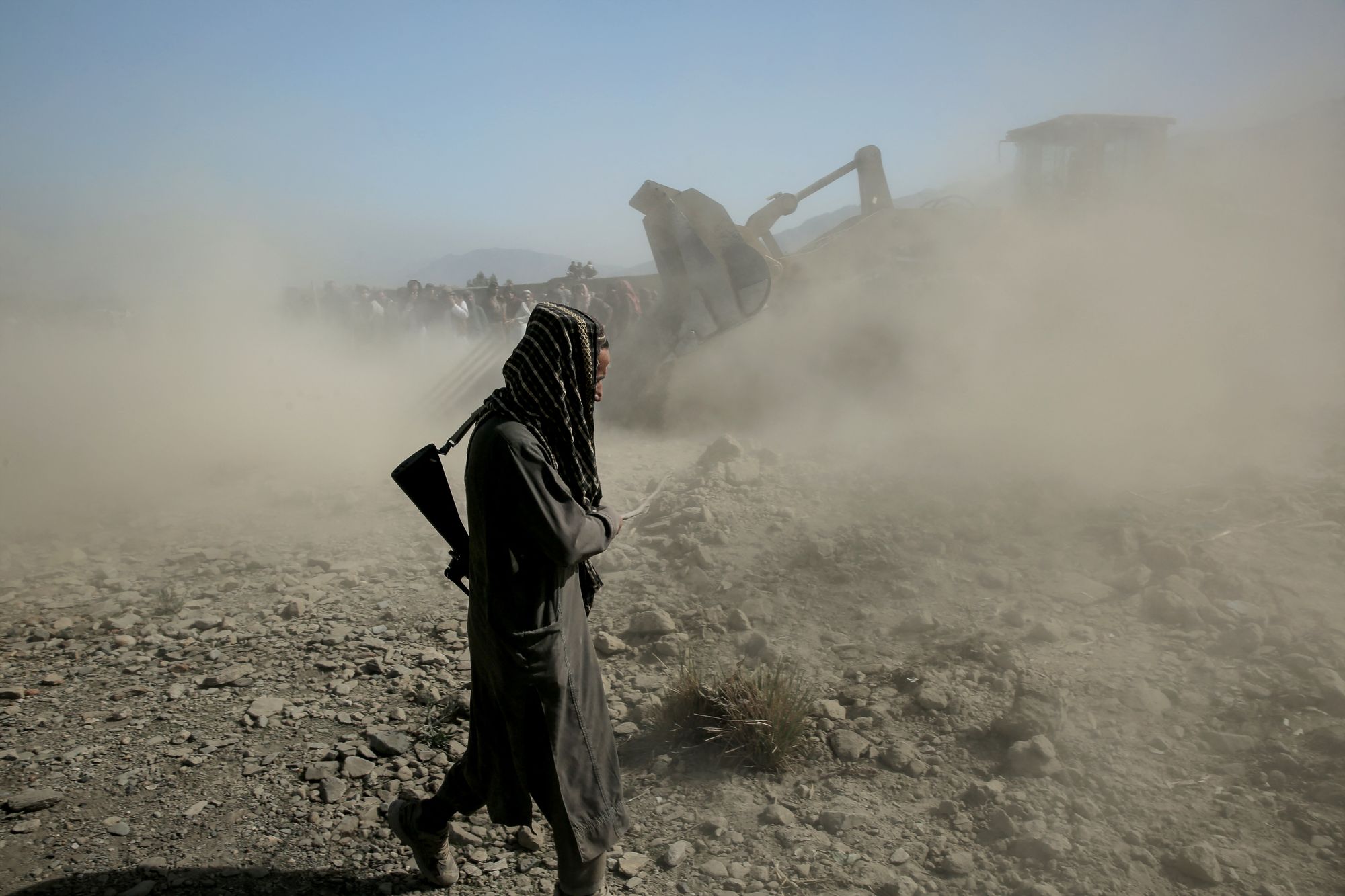 Taliban security personnel and residents search for victims after an overnight Pakistani air strike hit a residential area at the Girdi Kas village in Bihsud district, Nangarhar province on February 22, 2026. Pakistan said on February 22, it launched multiple air strikes targeting militants in neighbouring Afghanistan, where the government reported children were among dozens of people killed and wounded. (Photo by AFP via Getty Images)